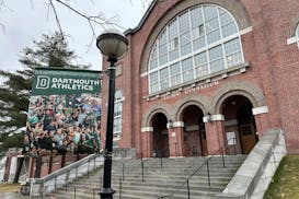 A Dartmouth Athletics banner hangs outside Alumni Gymnasium on the Dartmouth University campus in Hanover, N.H., Tuesday.