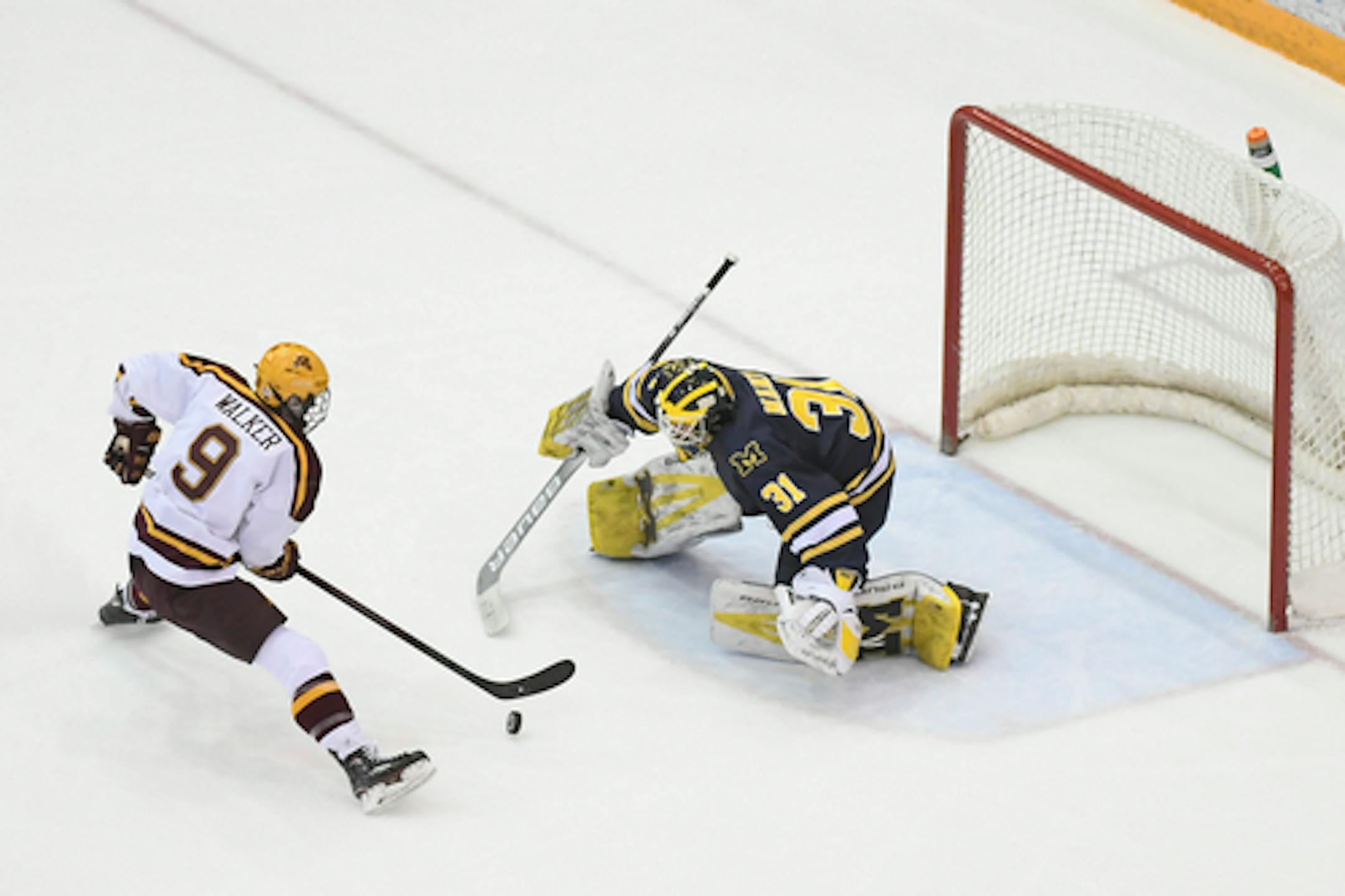 Minnesota Golden Gophers forward Sammy Walker (9) missed a goal against Michigan Wolverines goaltender Strauss Mann (31) during a short-handed opportunity in the second period.    ]   Aaron Lavinsky ¥ aaron.lavinsky@startribune.com