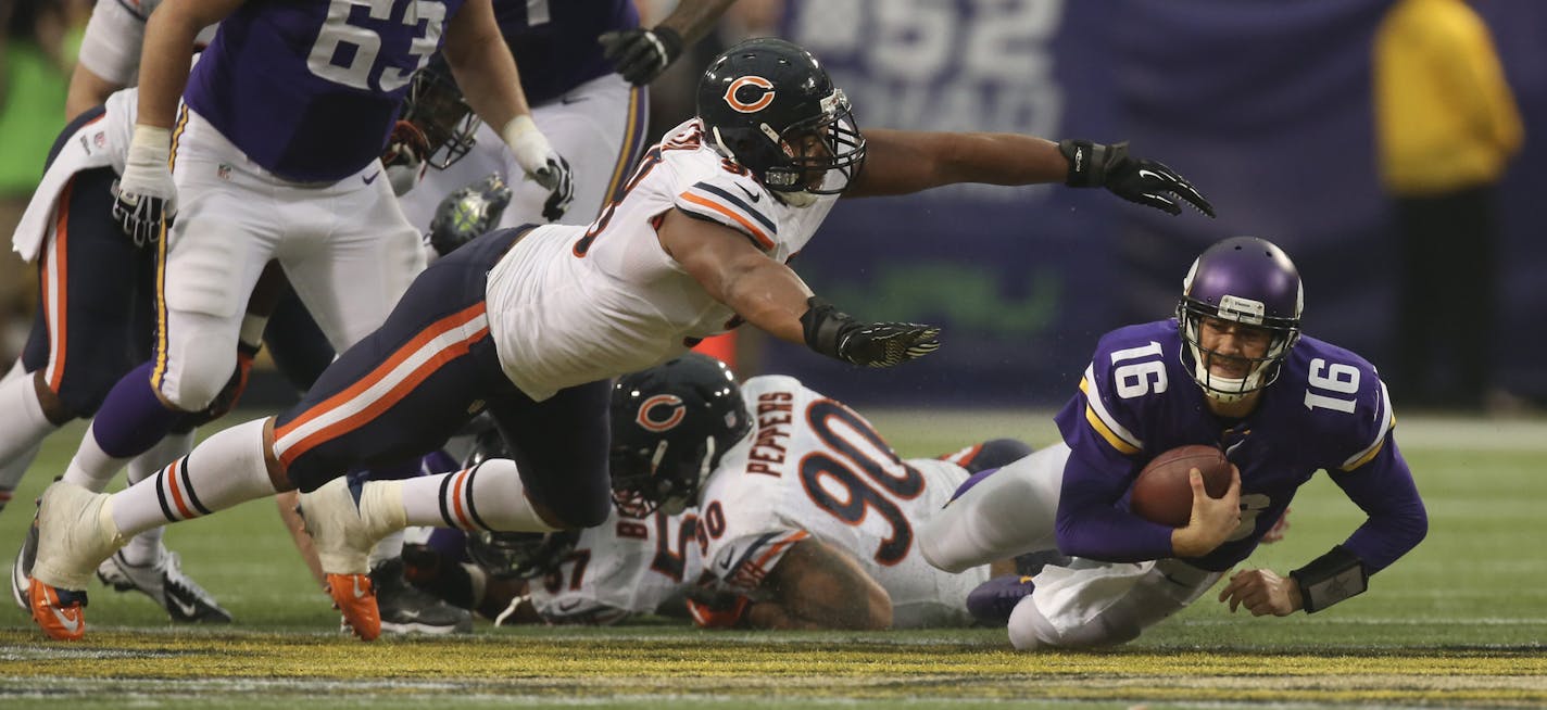 The Minnesota Vikings eeked out a 23-20 overtime win over the Chicago Bears in an NFL football game Sunday afternoon, December 1, 2013 and Mall of America Field in Minneapolis. Minnesota Vikings quarterback Matt Cassel (16) was sacked by Chicago Bears defensive tackle Corey Wootton (98) for a six yard loss in the third quarter. Chicago Bears defensive end Julius Peppers (90) also got partial credit for the sack. The Vikings had to punt on the next down. ] JEFF WHEELER &#x201a;&#xc4;&#xa2; jeff.w