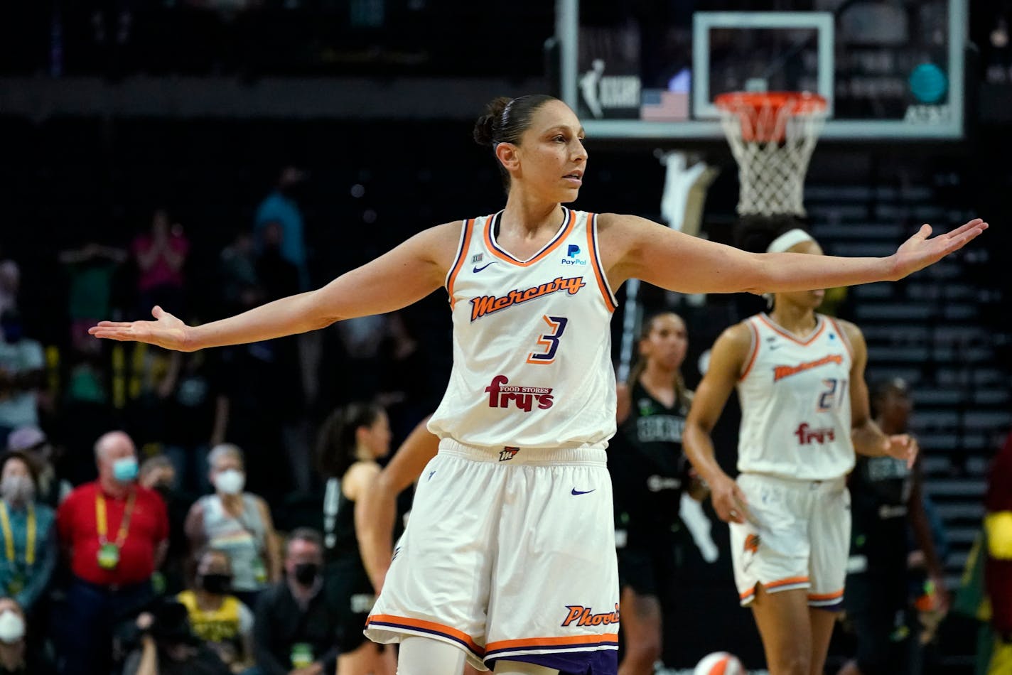 Phoenix Mercury's Diana Taurasi motions after a teammate scored in overtime against the Seattle Storm in the second round of the WNBA basketball playoffs Sunday, Sept. 26, 2021, in Everett, Wash. (AP Photo/Elaine Thompson)