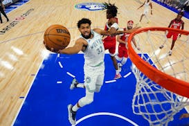 Karl-Anthony Towns of the Wolves headed to the basket during a game Wednesday night at Target Center against the Pelicans.