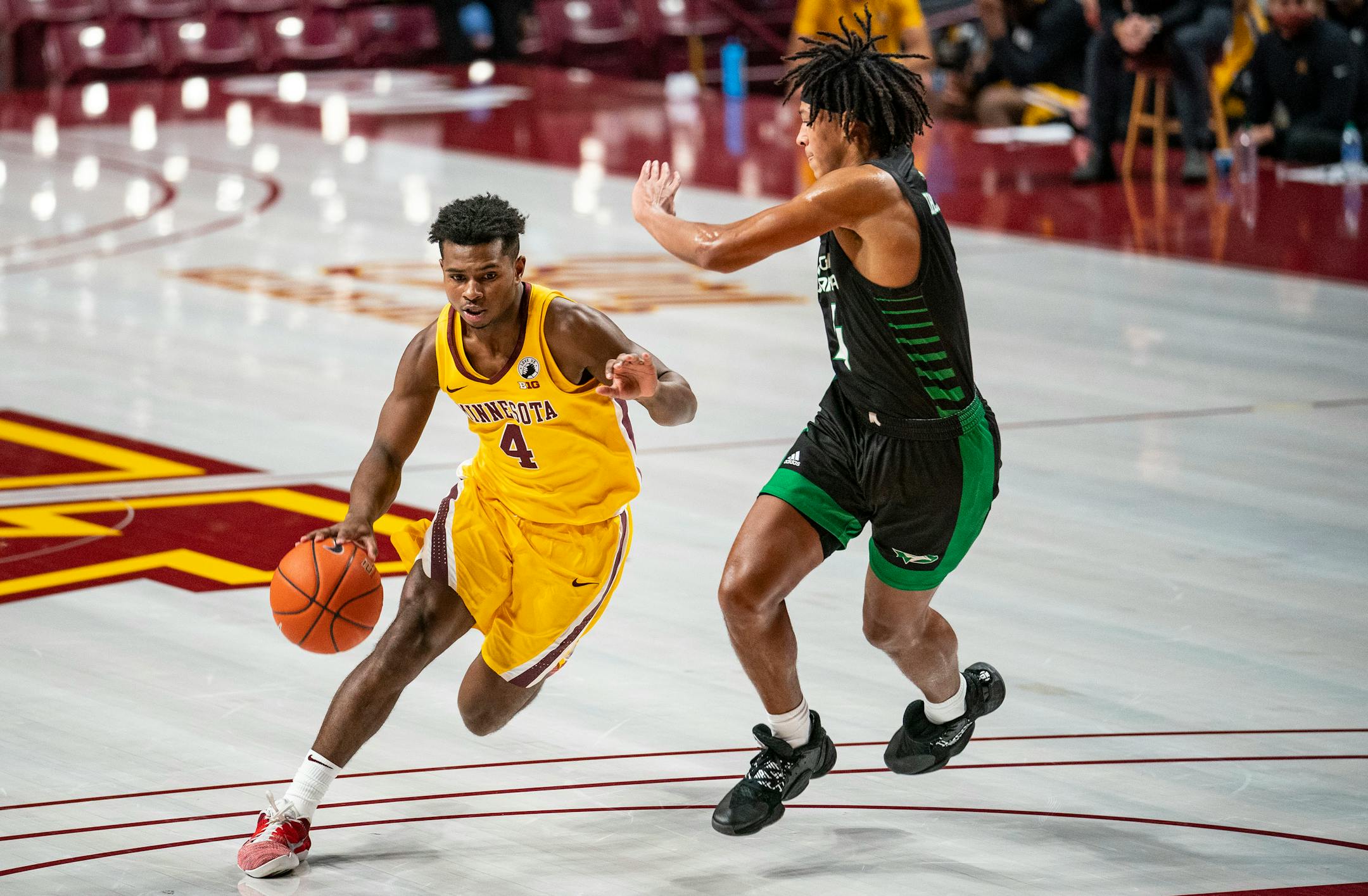 Gophers guard Jamal Mashburn Jr. drove past North Dakota guard Tyree Ihenacho in the first half