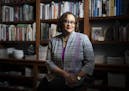 Macalester College Prof. Duchess Harris, shown at her Vadnais Heights home, is working on books for grades three to six that look at moments and figur