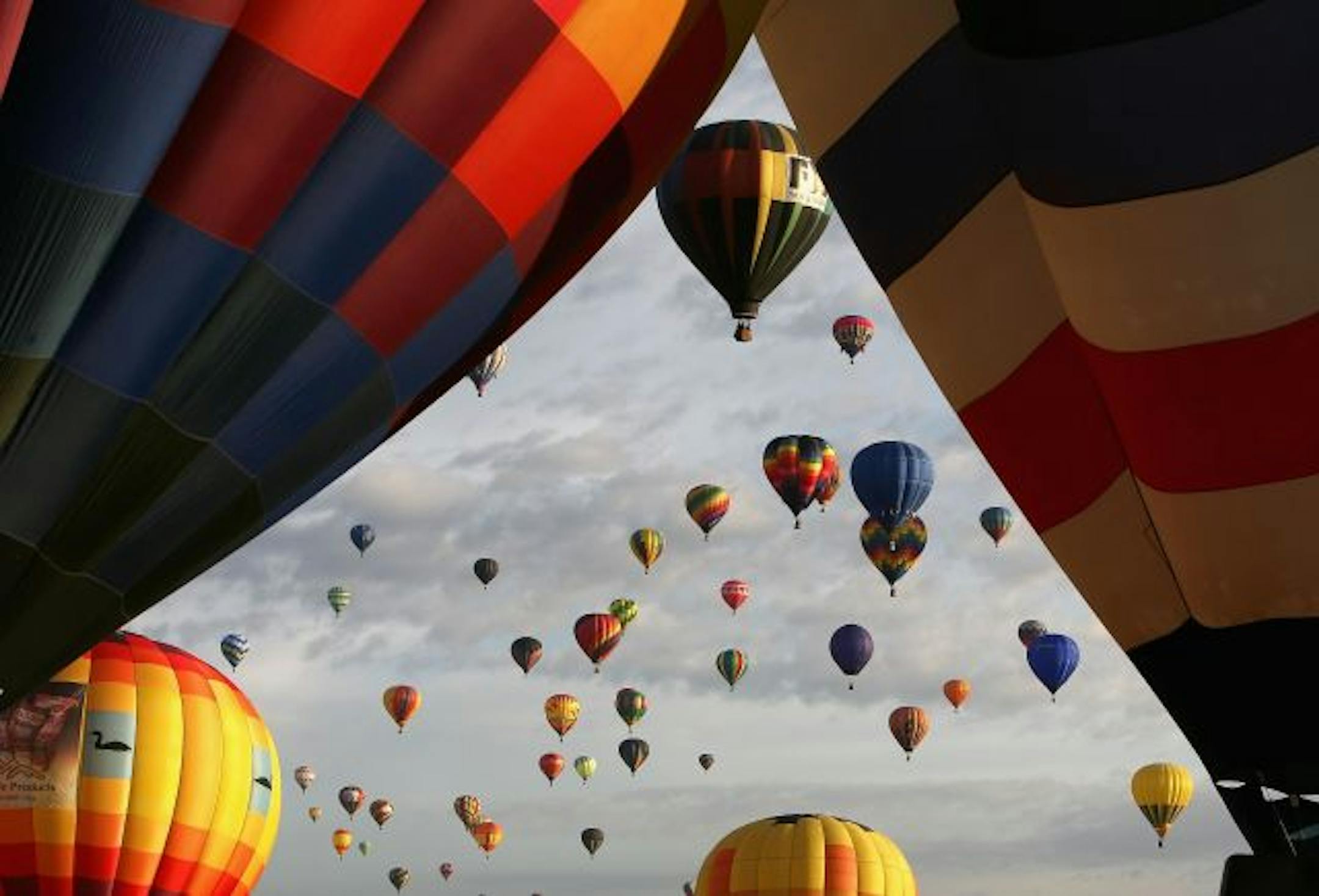 Hot air balloons soar over Balloon Fiesta Park during the Albuquerque International Balloon Fiesta on October 4, 2008. This year there are over 600 hot air balloons, representing 42 states and 24 countries.