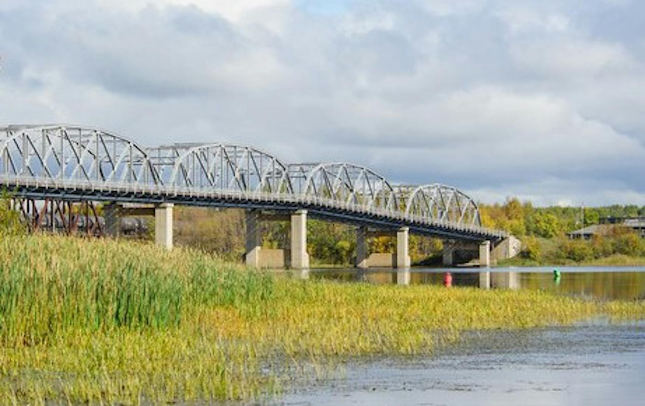 The state of Minnesota is giving away half of this bridge that spans the Rainy River between Baudette and Canada.