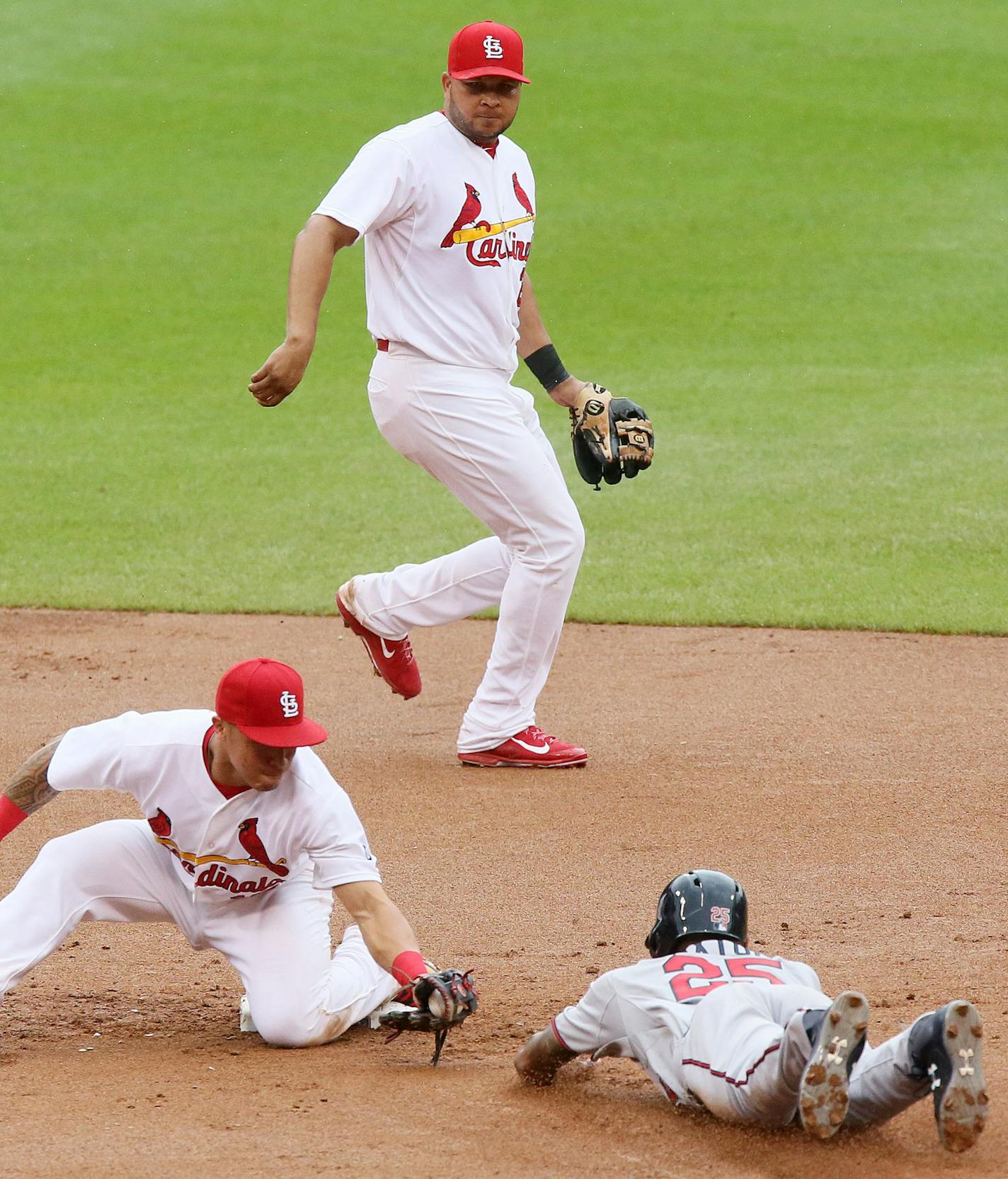 St. Louis Cardinals second baseman Kolten Wong (left) tags out Minnesota Twins' Byron Buxton trying to steal second in eighth inning action during a game between the St. Louis Cardinals and the Minnesota Twins on Tuesday, June 16, 2015, at Busch Stadium in St. Louis. Photo by Chris Lee, clee@post-dispatch.com