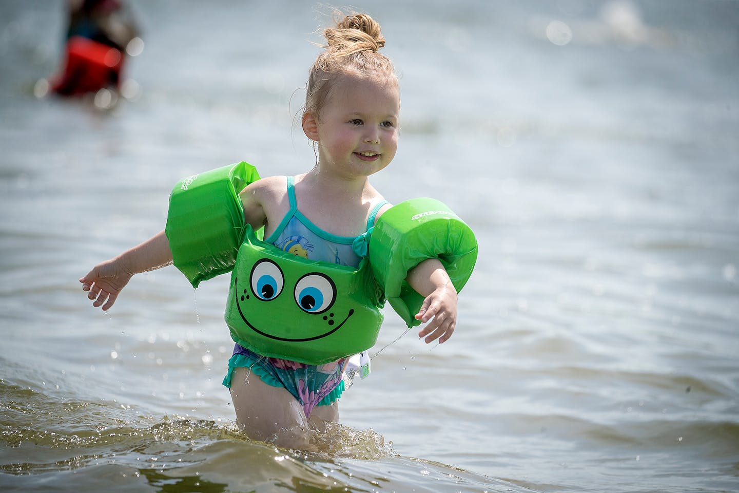 Adrielle Bedessem, 3, of Brooklyn Park showed her mother Delaine Bedessem how well she fared at swimming and keeping cool in a Lake Nokomis beach, Friday, June 29, 2018 in Minneapolis.