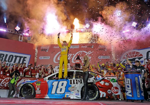 Kyle Busch celebrated after winning the Coca-Cola 600 at Charlotte Motor Speedway in 2018.