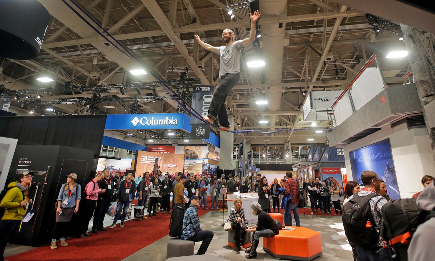 FILE - In this Jan. 11, 2017, file photo, people attend the Outdoor Retailer show at the Salt Palace Convention Center in Salt Lake City. A coalition of outdoor companies is ramping up threats to get a lucrative outdoor trade show to leave Utah unless the governor and elected officials back away from policies they say threaten public lands. Thirty outdoor companies sent a letter to Republican Gov. Gary Herbert on Tuesday, Feb. 14, 2017, saying the actions taken by Utah leaders threaten the outdo