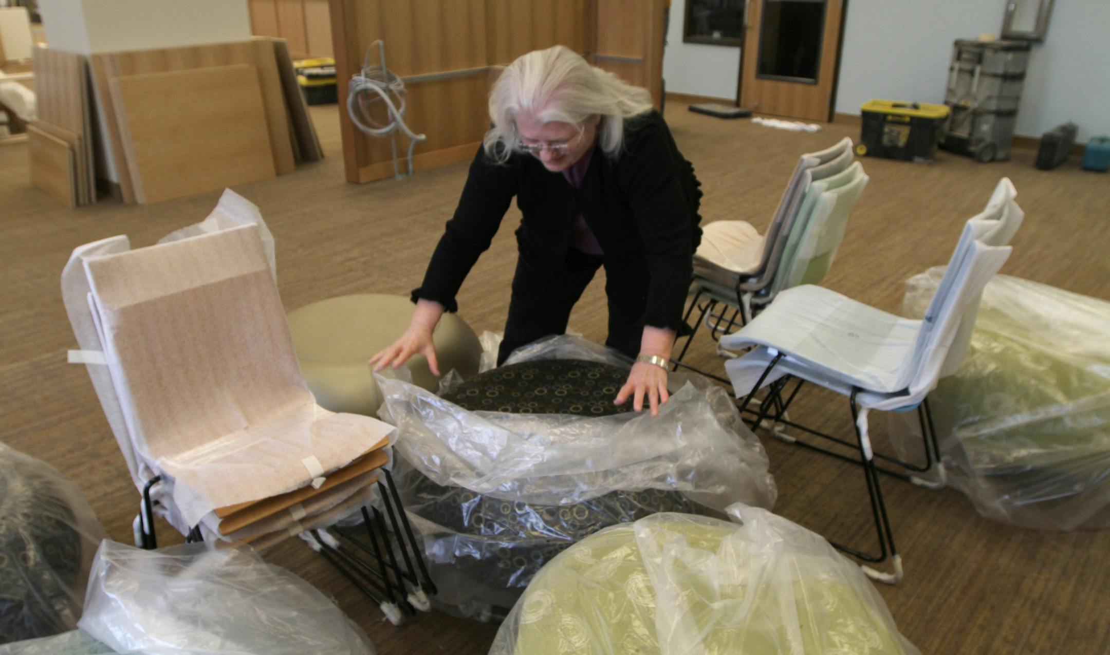 (center) Vanessa Birdsey, Library Director, unwrapped seats in the childrens area, at the new Scott County Library in Jordan MN. The new library is scheduled to open around labor day. Photographed on 5/1/13.] Bruce Bisping/Star Tribune bbisping@startribune.com Vanessa Birdsey/source.