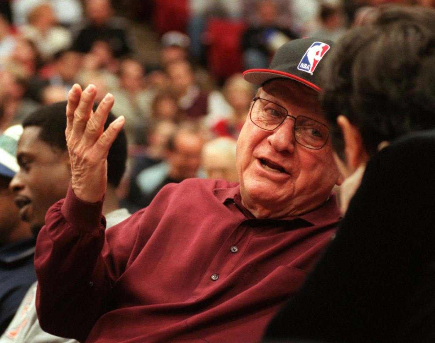 Minneapolis, Mn., Tues., Dec. 5, 2000--Marv Wolfenson talks with Marge Weiser during halftime of the Timberwolves-Chicago Bulls game Dec. 5th. Marge and Irv Weiser sit near Wolfenson on the court at the games.