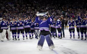 Frost goaltender Maddie Rooney celebrates with the Walter Cup after a 2-1 overtime victory in Game 4 Monday at Xcel Energy Center.