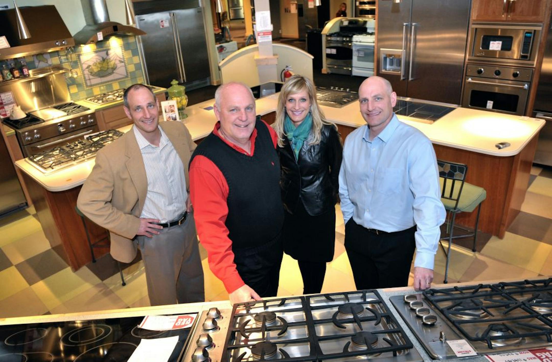 Members of the Warner family of Warners' Stellian, Bob Warner, VP, director of operations; Jeff Warner, president; Carla Warner, VP director of sales; Bill Warner, VP director of merchandising. The four came together in their Edina store.
