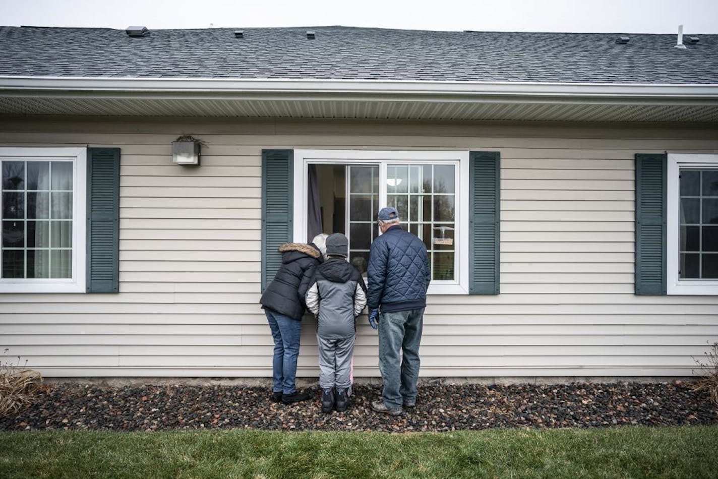 Katherine Berg with husband Brian Berg, and grandkids Cullen Beeler, 8, and Laney Beeler, 5, visited her mom 99-year-old mom Eleanor Murray at the Prairie Senior Cottages in Isanti, Minn.