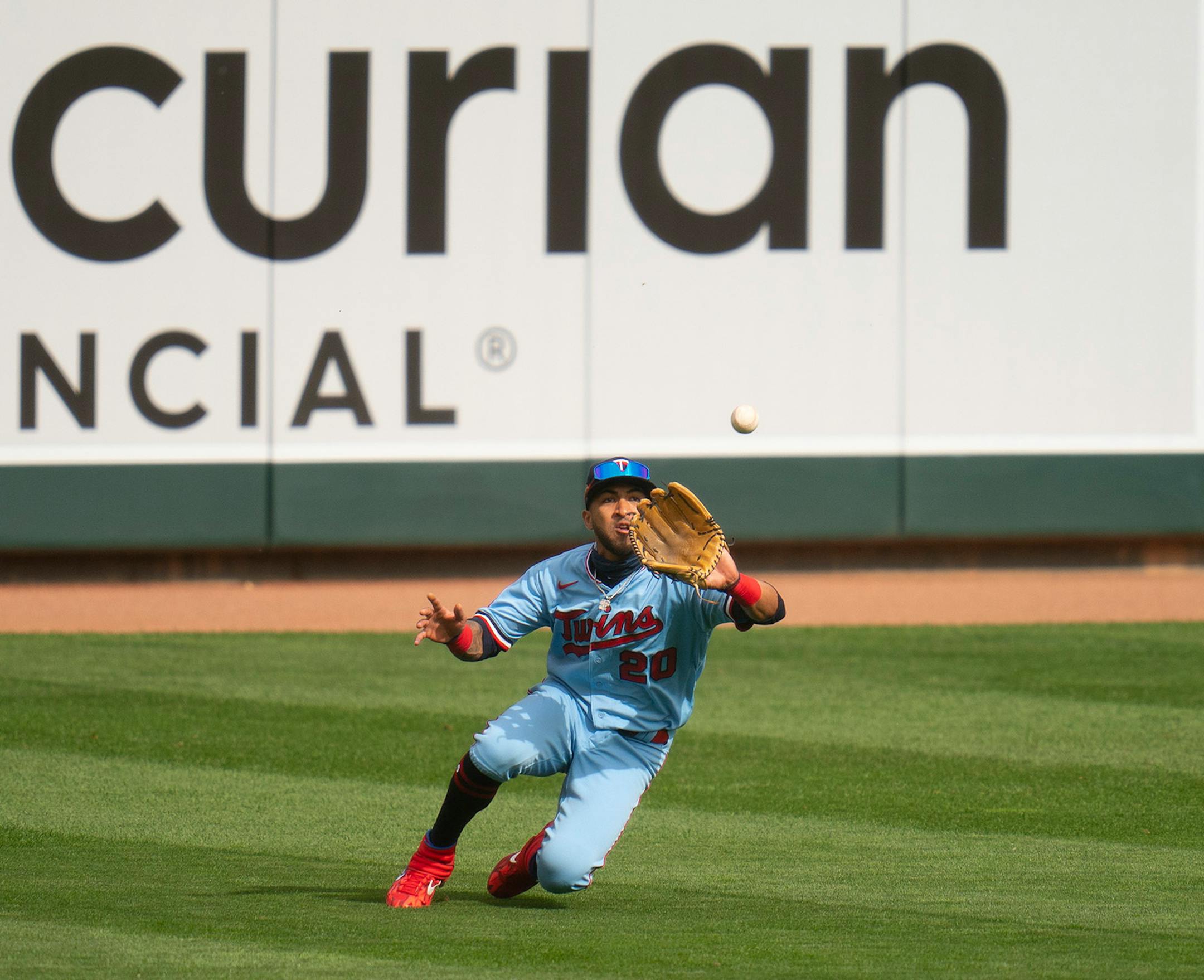 Minnesota Twins left fielder Eddie Rosario (20) caught a line drive by the Cincinnati Reds left fielder Aristides Aquino (44) for a third inning out.