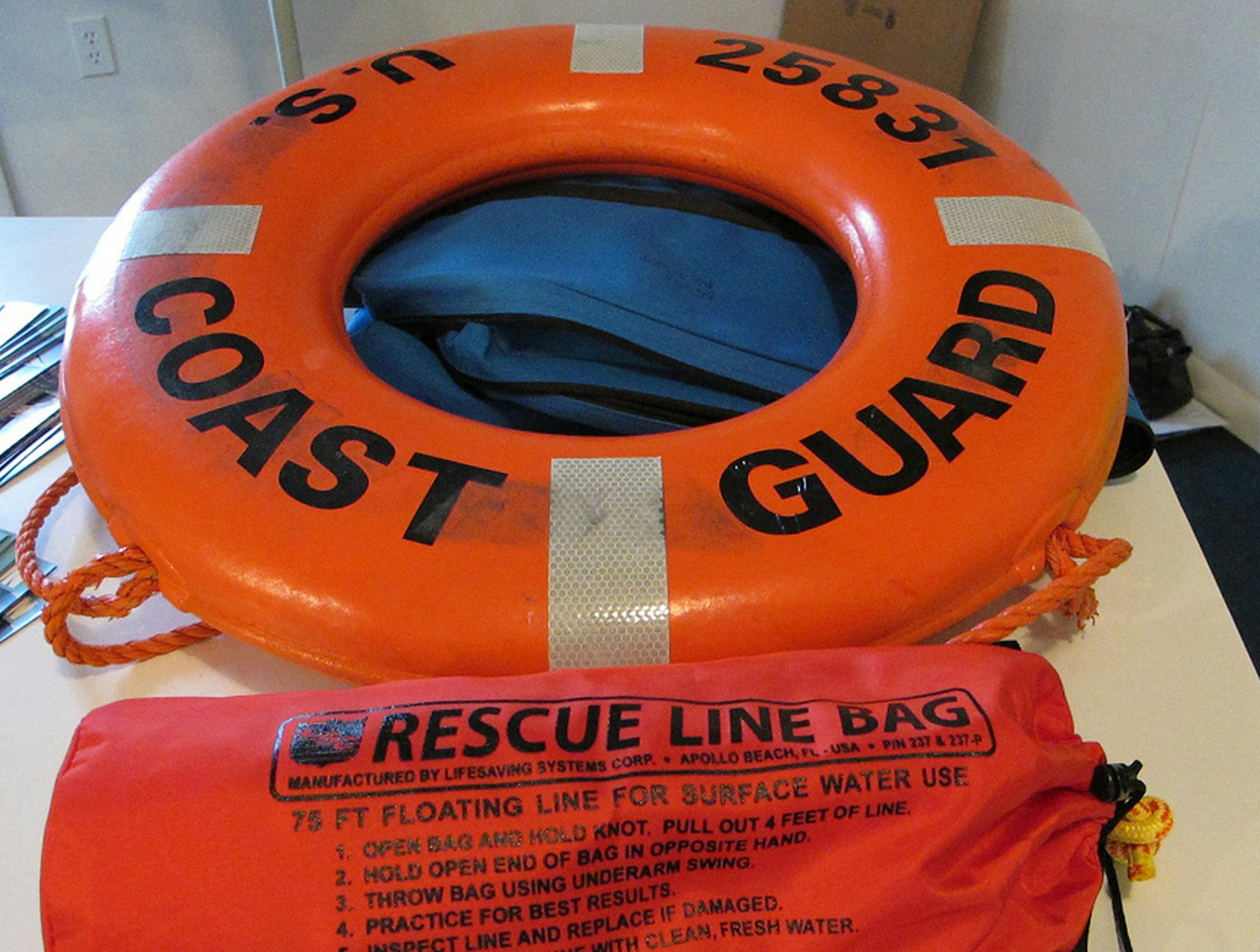 In a 2011 photo provided by the Michigan Sea Grant, a rescue line bag and ring buoy are seen from the Great Lakes Water Safety Conference 2011 in Gaylord, Mich. An effort to prevent people from drowning due to dangerous currents along the Great Lakes includes installing kits with life-saving aids including a ring buoy at 10 public beaches along Lake Michigan. Michigan Sea Grant announced Monday, May 19, 2014, that kits will be installed this summer. Additional support from the National Oceanic a