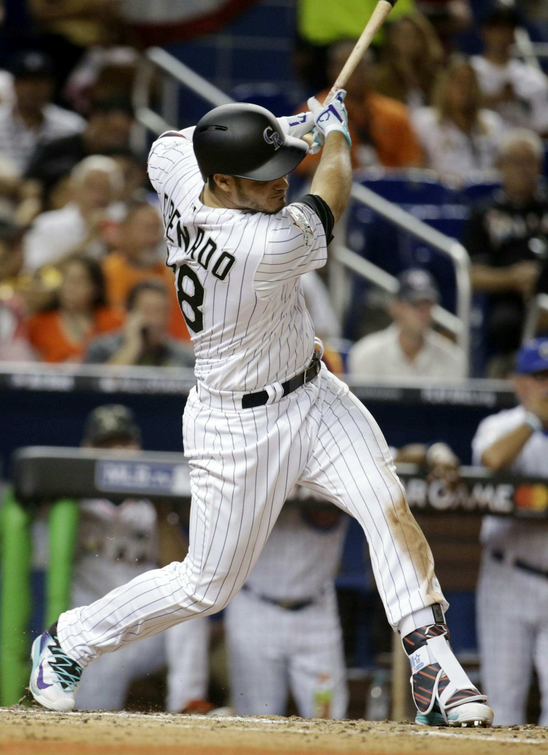 National League's Colorado Rockies third baseman Nolan Arenado (28) singles during the fourth inning, during the MLB baseball All-Star Game, Tuesday, July 11, 2017, in Miami.
