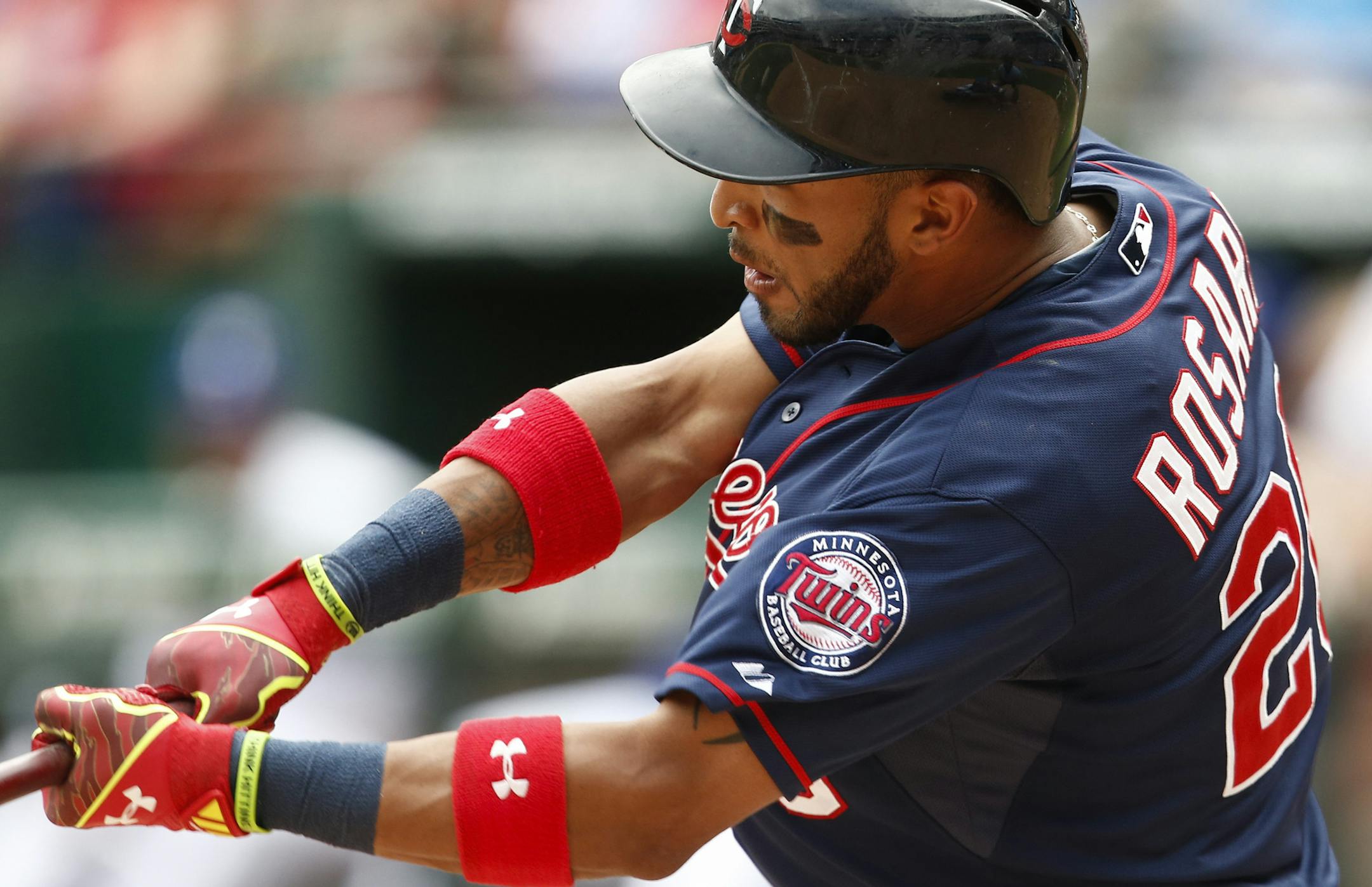 Minnesota Twins' Eddie Rosario swings for an RBI-double scoring Byron Buxton for the go-ahead run against the Texas Rangers during the ninth inning of a baseball game, Sunday, June 14, 2015, in Arlington, Texas. The Twins won 4-3. (AP Photo/Jim Cowsert)