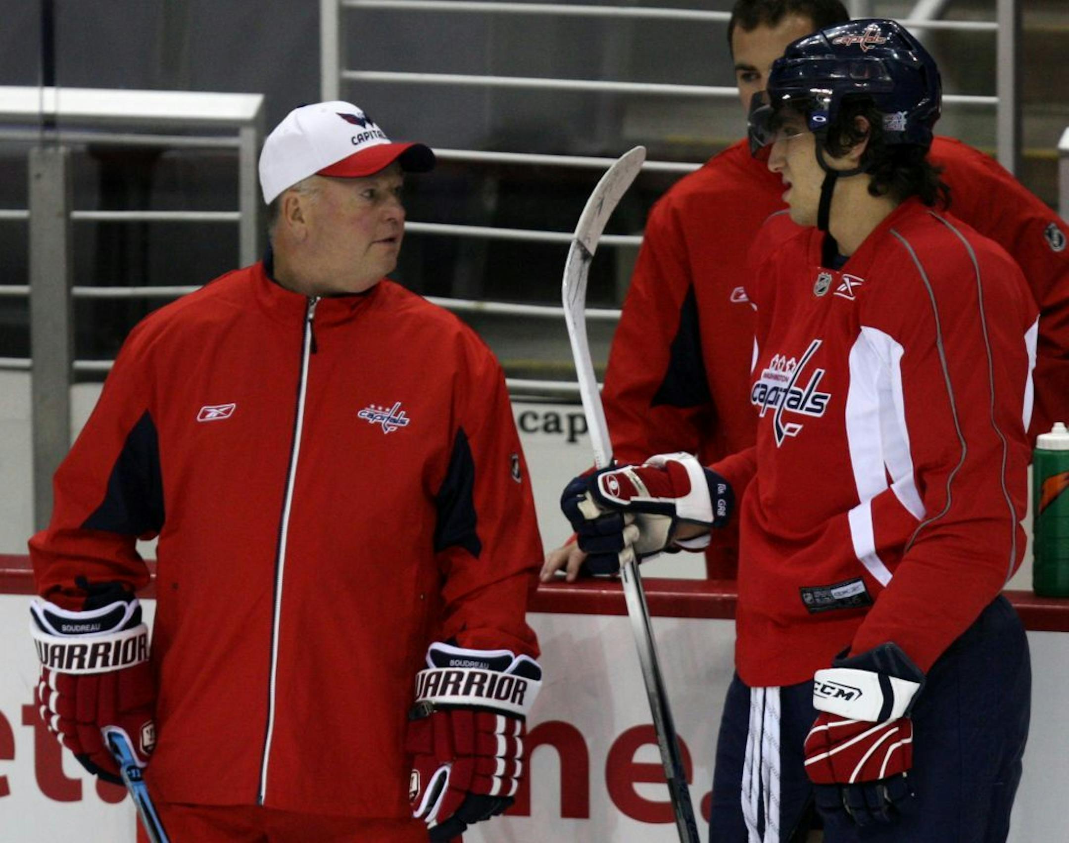 Bruce Boudreau, left, talks with Alex Ovechkin when Boudreau coached the Washington Capitals.