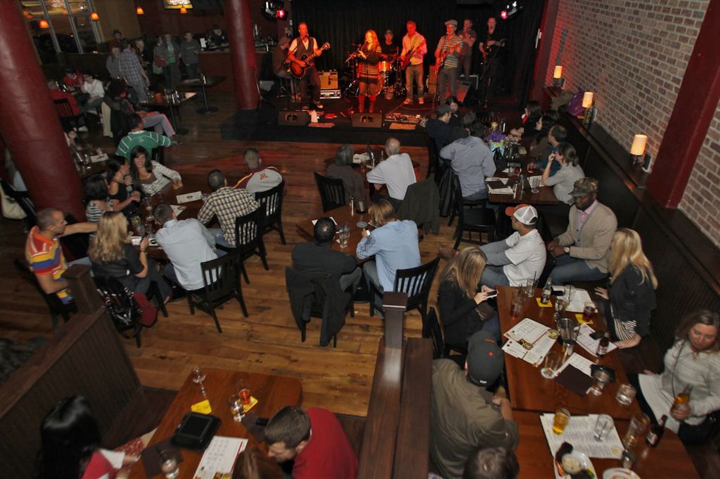 The Crooked Pint Ale House in Minneapolis recently completed a remodeling resulting in a two-tier customer space and a central bar. The band Hookers and Blow played to a crowd on a recent night.