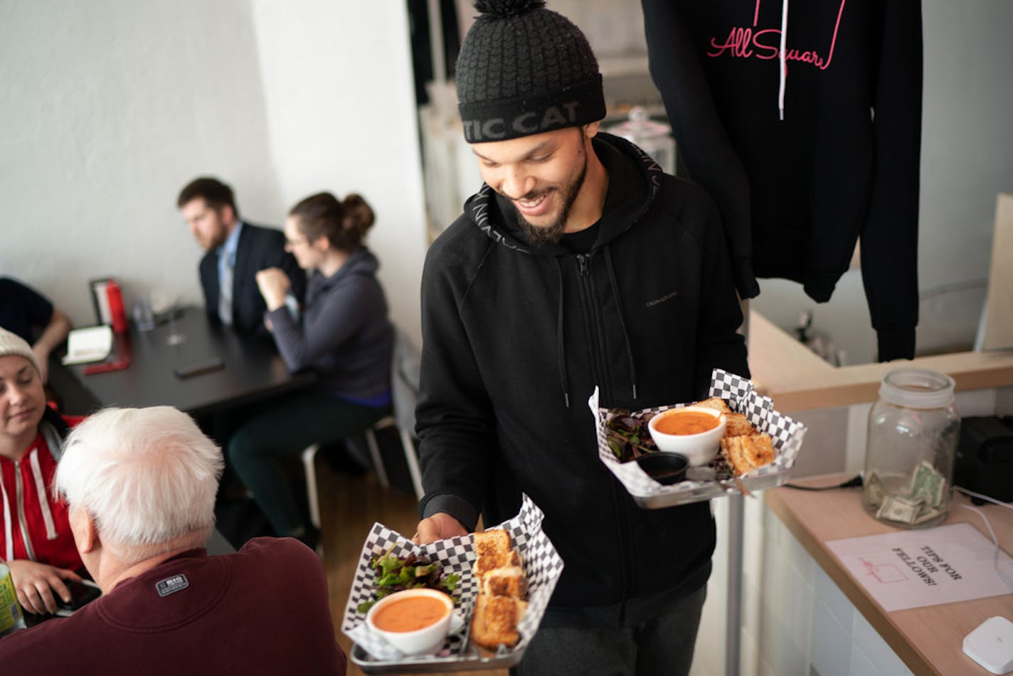 Tomas Reynolds delivered sandwiches to customers. ] GLEN STUBBE • glen.stubbe@startribune.com Friday, February 22, 2019 Founded by a civil rights attorney, All Square grilled cheese shop employs formerly incarcerated people -- who often find it difficult to land a job -- giving them a chance to move forward after they've paid their debts to society. We come for the lunch rush (starts at 12) to see All Square and its employees in action. Around 1:30 when things quiet down, I'll be interviewing Al