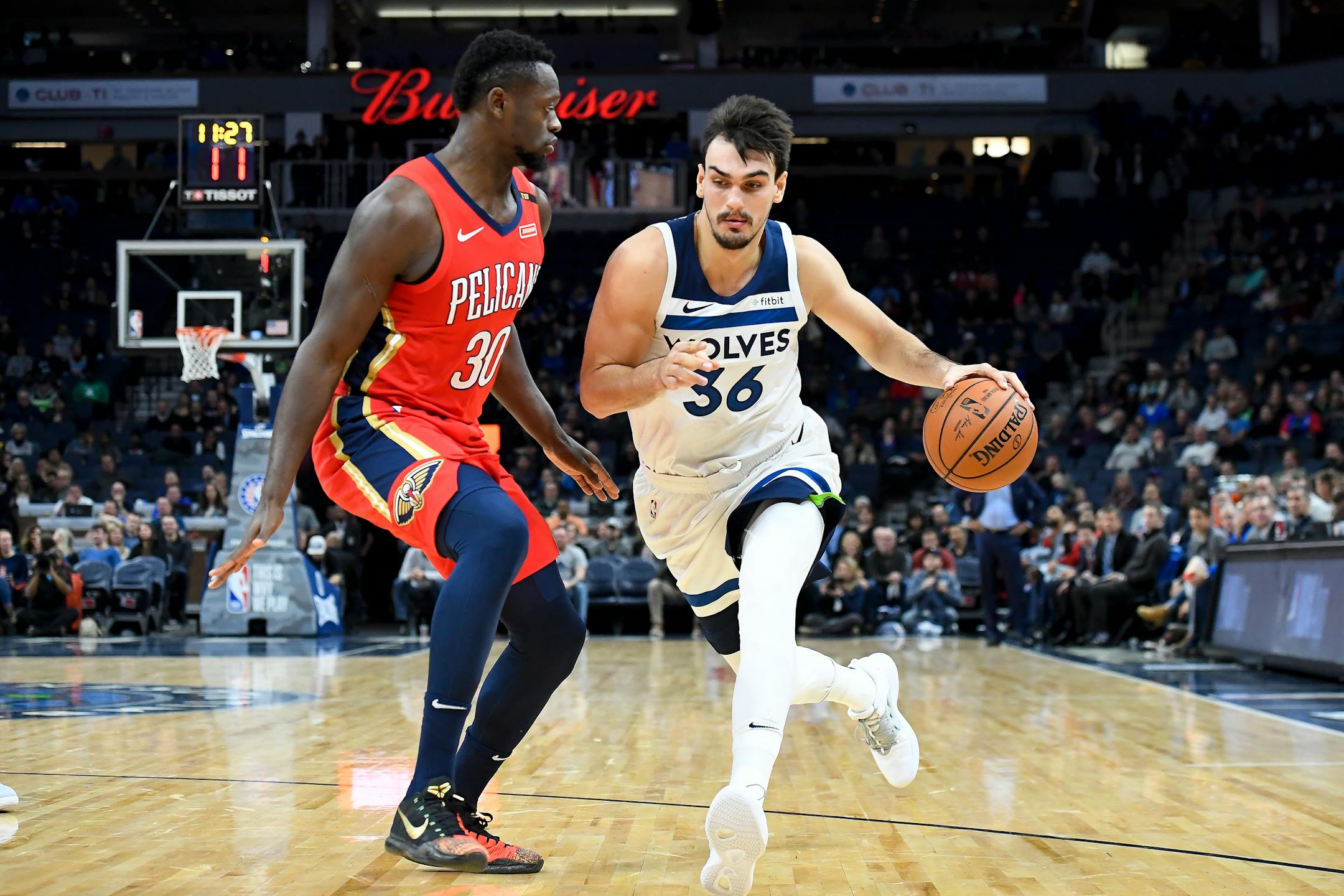 Dario Saric, right, drives against the New Orleans Pelicans' Julius Randle in the first half on Wednesday
