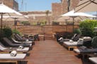 The Mercer Hotel&#x2019;s rooftop terrace abuts a Roman wall.
