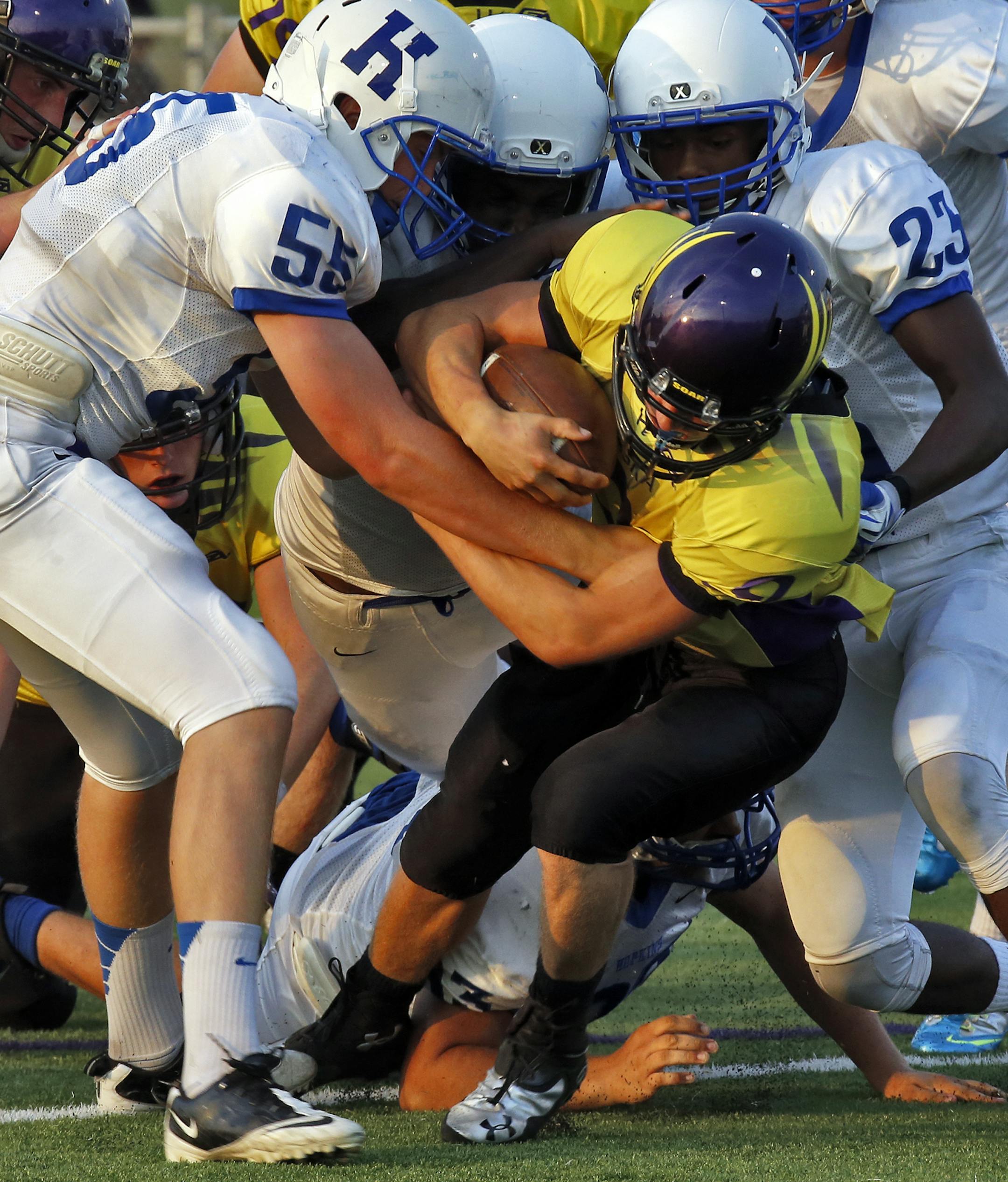 Hopkins vs. Chaska high school football. Hopkins defenders brought down Chaska quarterback Justin Arnold after a short gain in first half action. (MARLIN LEVISON/STARTRIBUNE(mlevison@startribune.com)