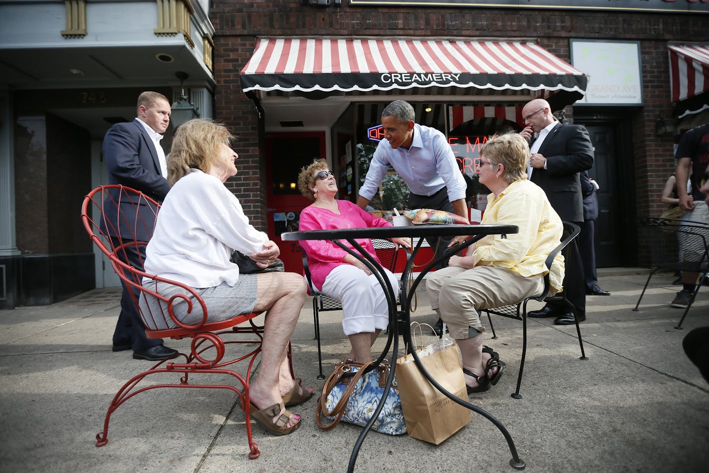 President Barack Obama talked with three ladies outside of the Grand Ole Creamery as he walked down Grand Avenue in St. Paul Thursday June 26, 2014 in St. Paul , MN. ] Jerry Holt Jerry.holt@startribune.com