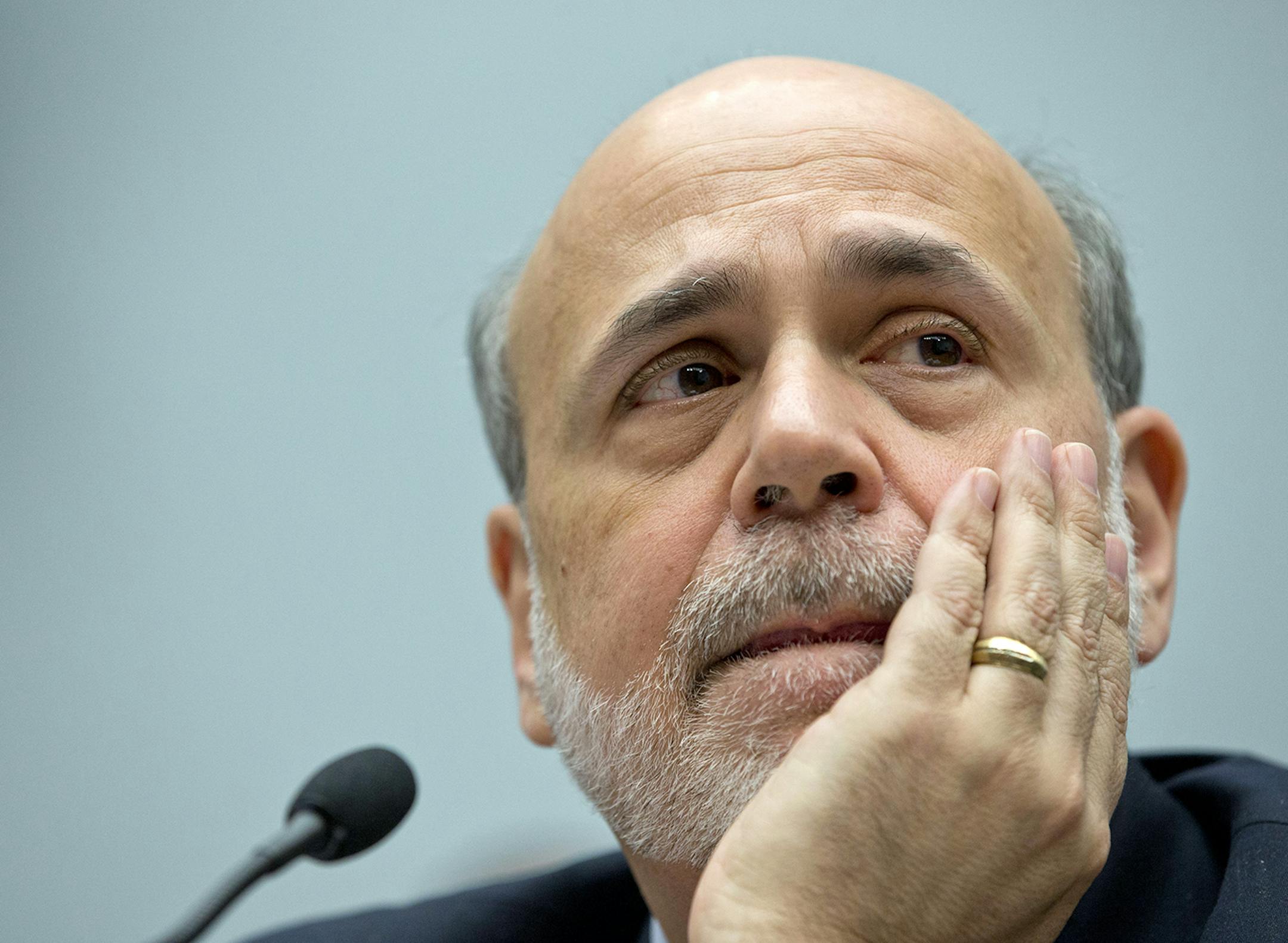 Federal Reserve Chairman Ben Bernanke pauses to listen to questions as he testifies on Capitol Hill in Washington, Wednesday, Feb. 27, 2013, before the House Financial Services Committee hearing on: Monetary Policy and the State of the Economy. (AP Photo/Carolyn Kaster) ORG XMIT: MIN2013031512293927