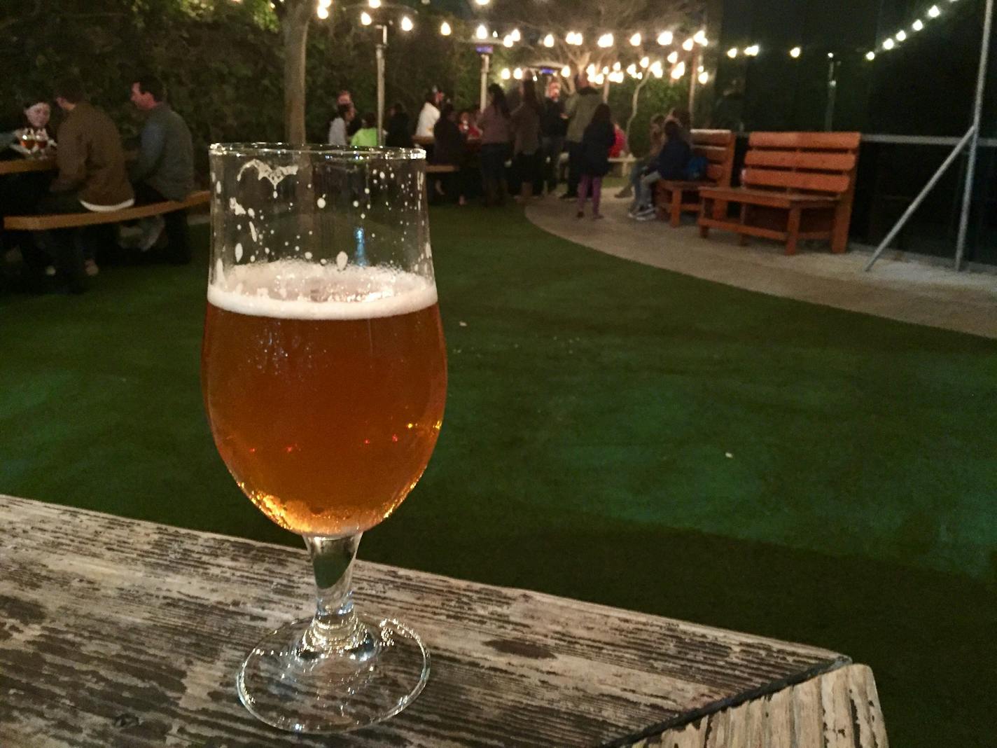 Beer drinkers gathered on the outdoor patio at Green Flash Brewing in San Diego, one of a growing number of taprooms drawing locals and tourists.