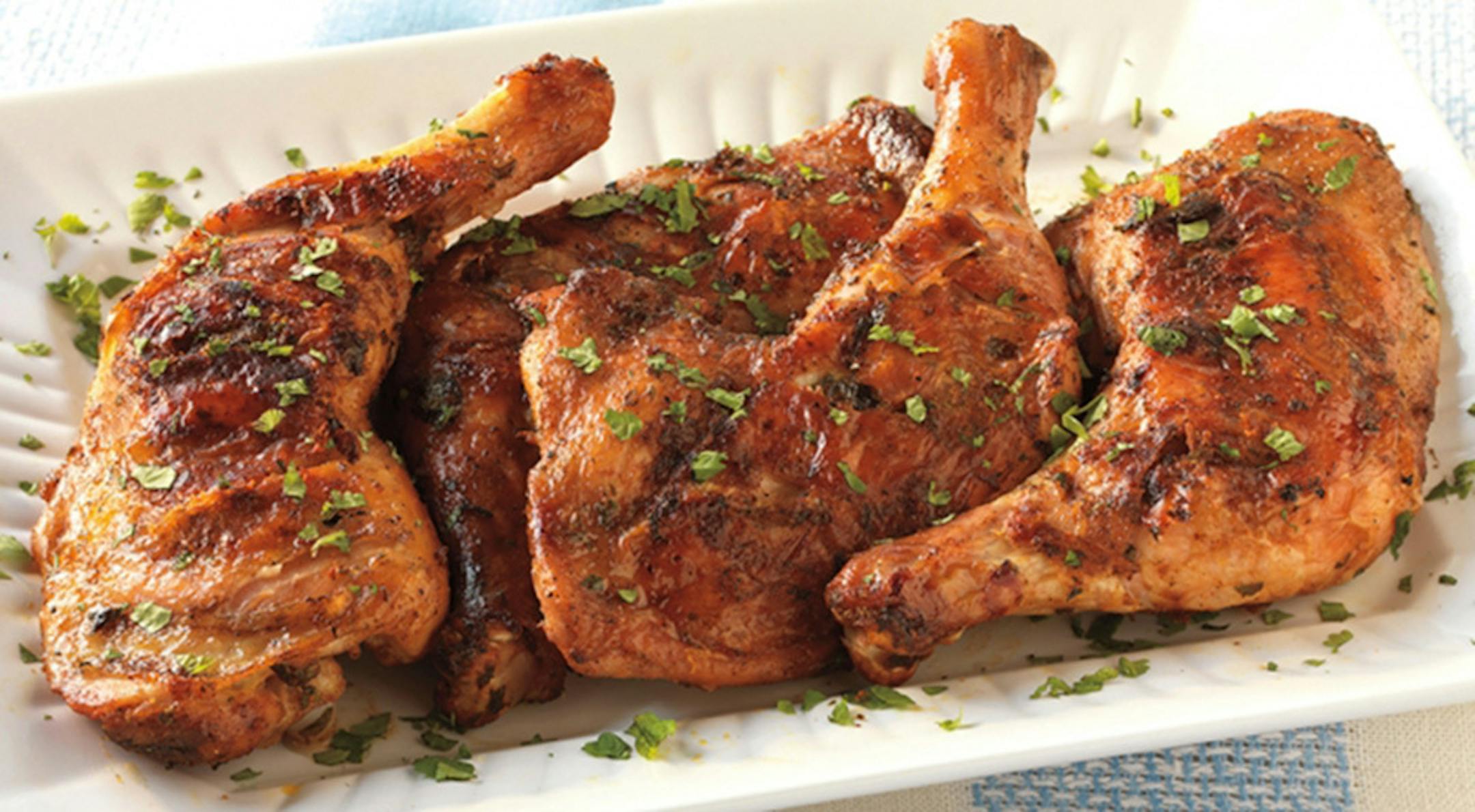 Credit: Weber
Moroccan-Spiced Chicken Legs Under Bricks