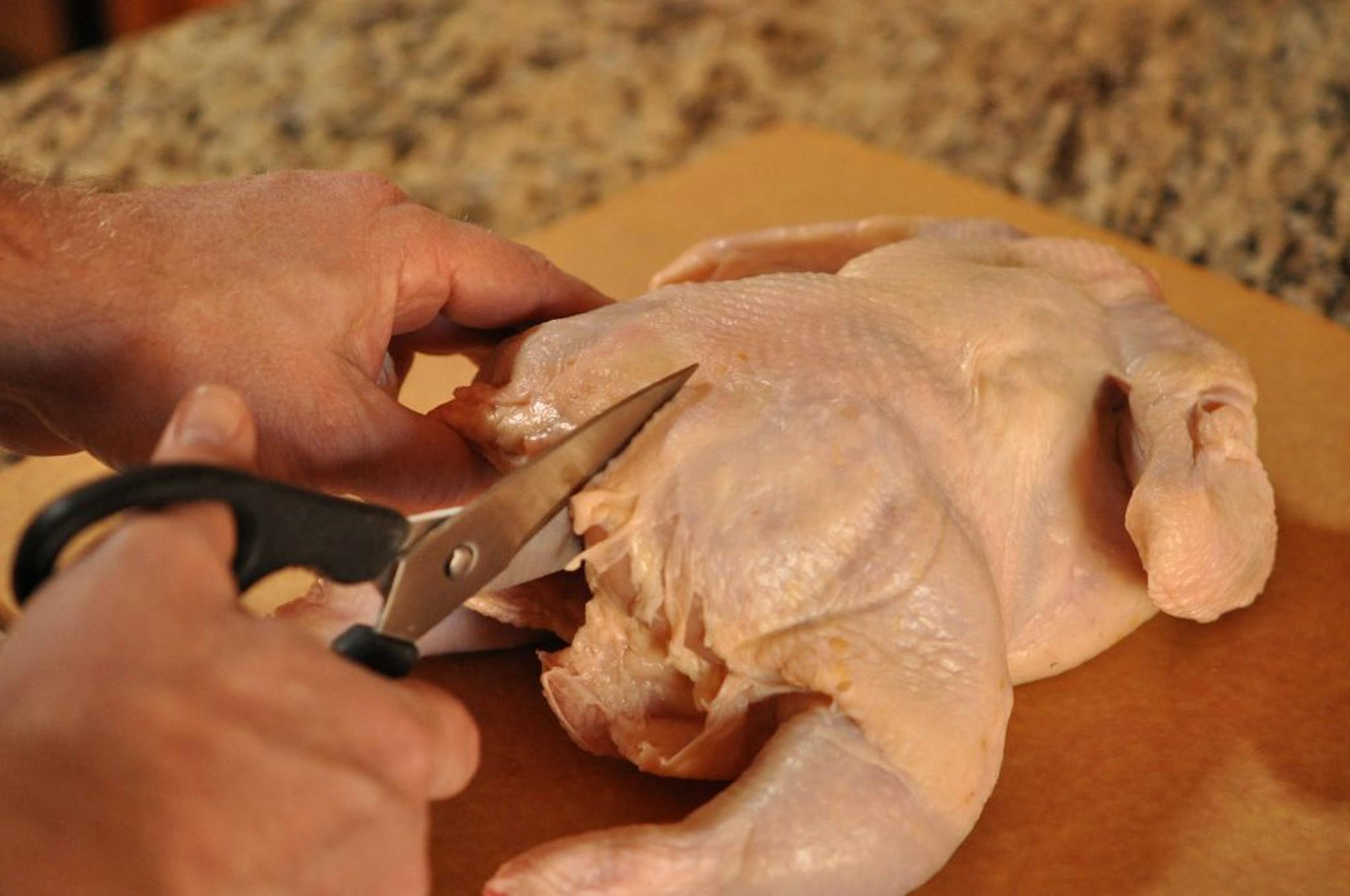 To butterfly a chicken: Use kitchen shears to cut the backbone.