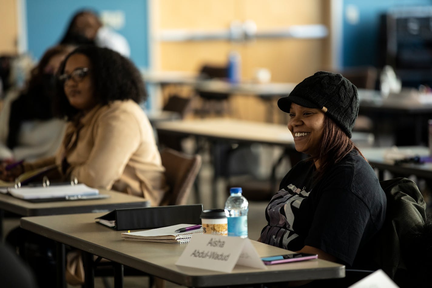 Attendees talk and listen to panelists at an event for the Community Entrepreneurship Program at Allina Commons in Minneapolis on March 23, 2022. The program is supported by the Opus College of Business and the Small Business Development Center to help expand the dream of business ownership to underserved communities.