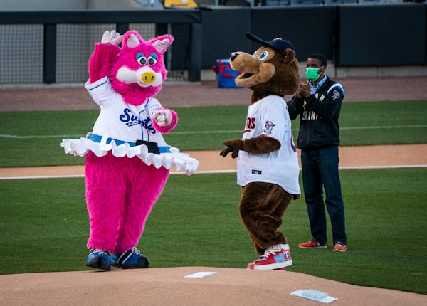 Mudonna and T.C. Bear joined St. Paul Mayor Melvin Carter for the ceremonial first pitch at the St. Paul Saints home opener last season.