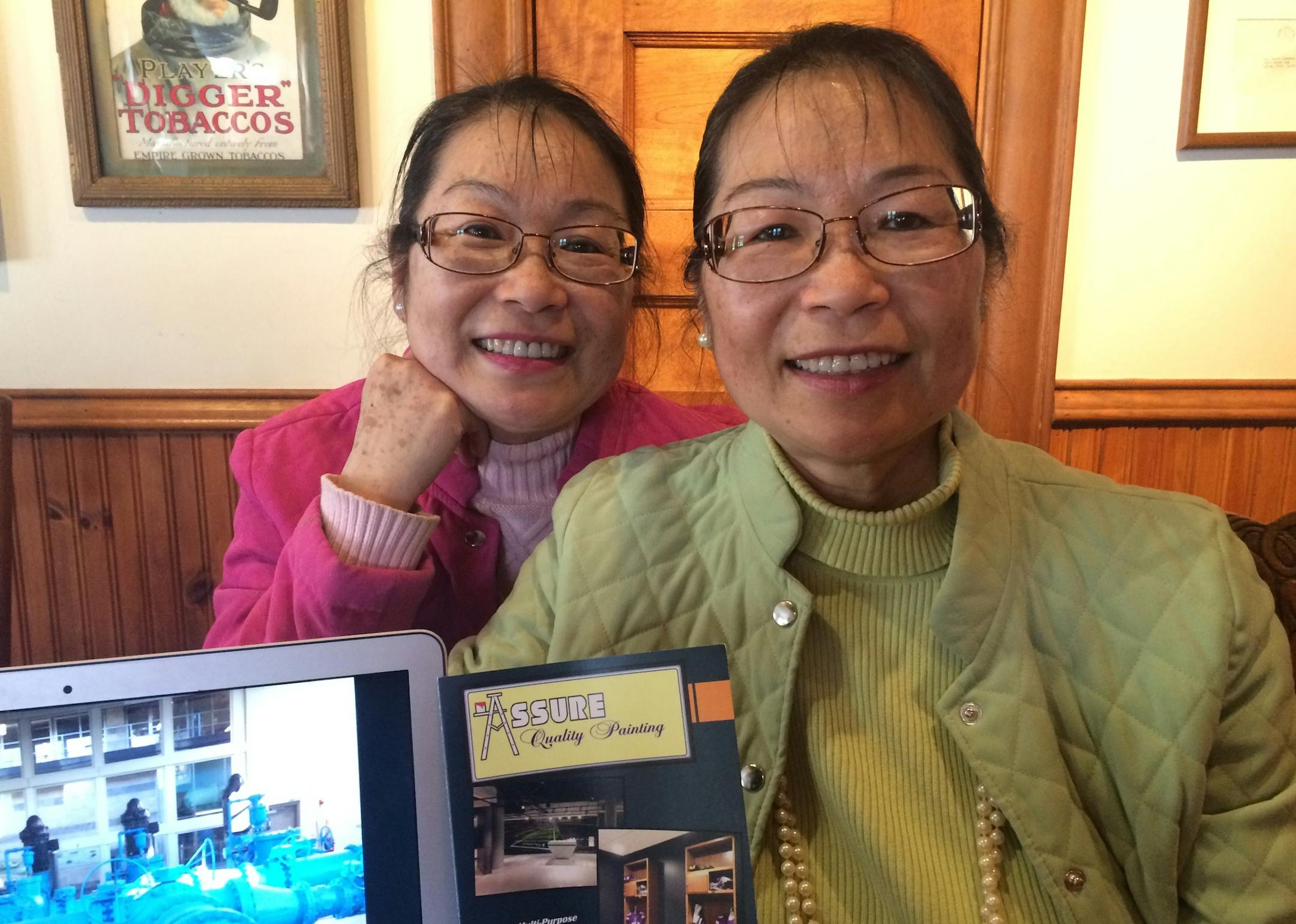 Winnie Yuen-Yee Crosbie and Jane Yuen-Lin Mahowald, penniless twin sisters from China in 1972, are American success stories who, nevertheless, are having trouble raising bank credit to fund Jane's industrial-painting company despite job orders. Photo: Neal.St.Anthony@startribune.com