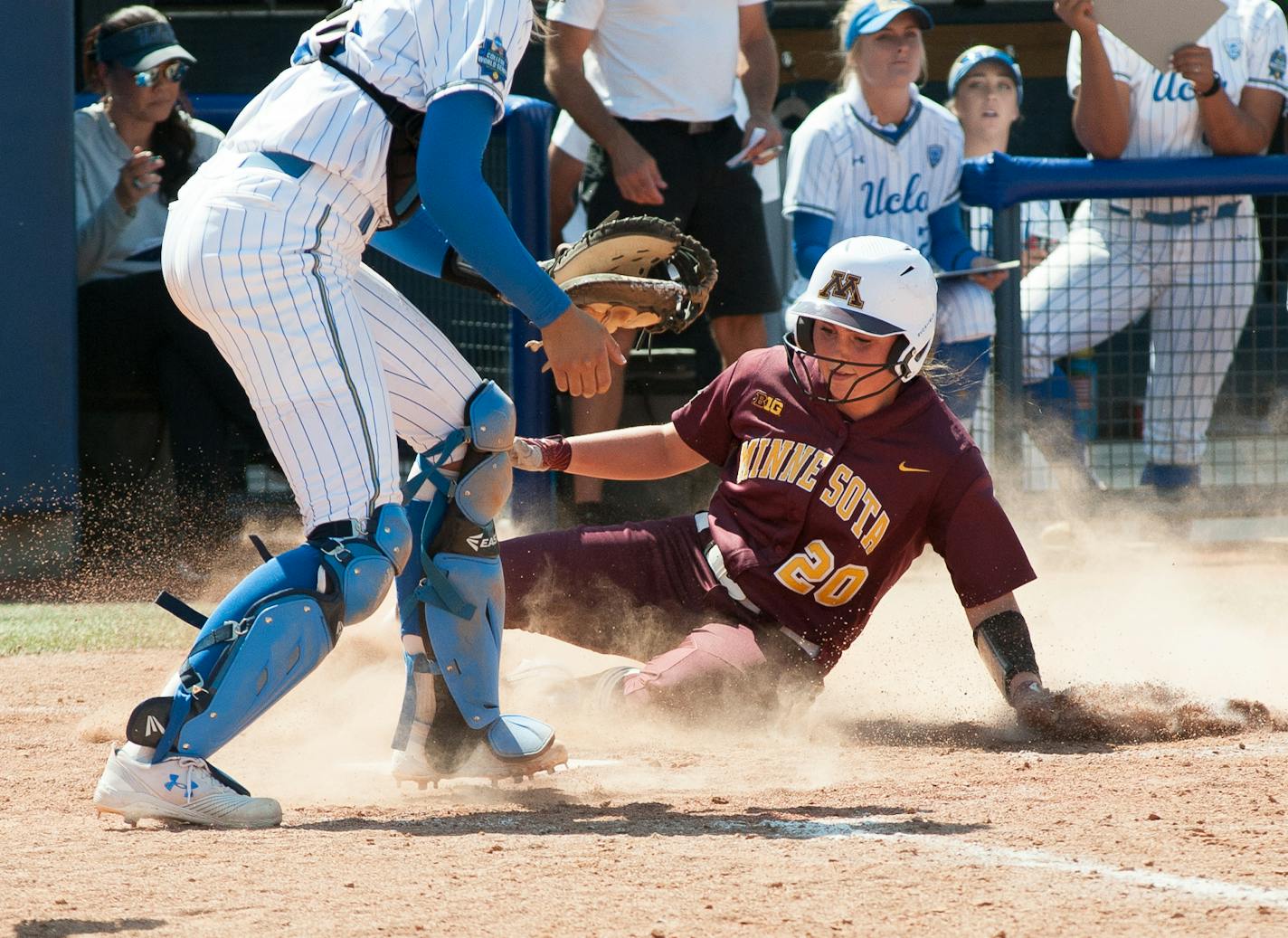 Minnesota #20 Maddie Houlihan sliding into home versus UCLA at the 2019 Women's College World Series at the Softball Hall of Fame in Oklahoma City ORG XMIT: TP101