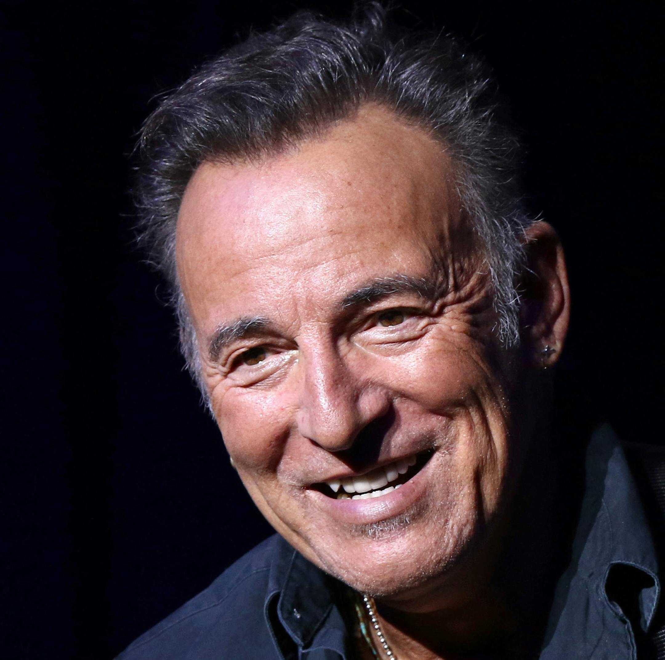 FILE - In this Nov. 10, 2015 file photo, Bruce Springsteen performs at the 9th Annual Stand Up For Heroes event in New York. A Philadelphia fifth-grader ditched school for the chance to meet the rock legend at his book signing Thursday, Sept. 30, 2016, and The Philadelphia Inquirer reports “The Boss” gladly played along by signing the boy’s absence excuse note. (Photo by Greg Allen/Invision/AP, File)