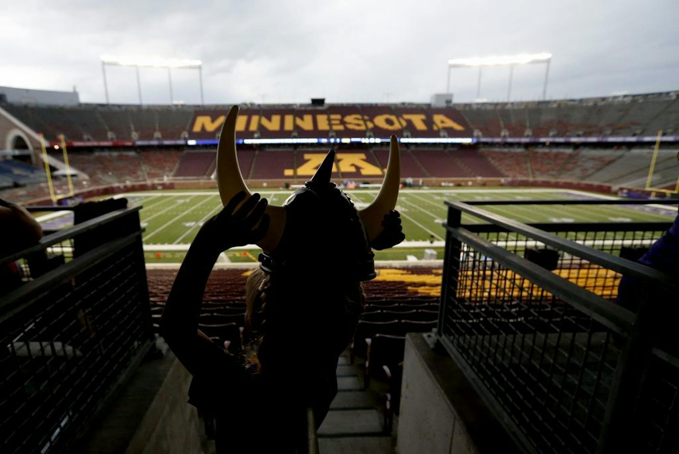 Greyson Elseth, 6, of West Fargo adjusted his horns during a weather delay at TCF Bank Stadium before Saturday's game between the Minnesota Vikings and Oakland Raiders. The field and stands were briefly evacuated because of lightning strikes in the area.
