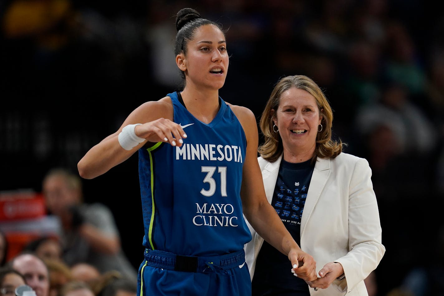 Minnesota Lynx forward Nikolina Milic (31) and head coach Cheryl Reeve stand together during the second half of a WNBA basketball game against the Indiana Fever, Friday, June 9, 2023, in Minneapolis. (AP Photo/Abbie Parr)