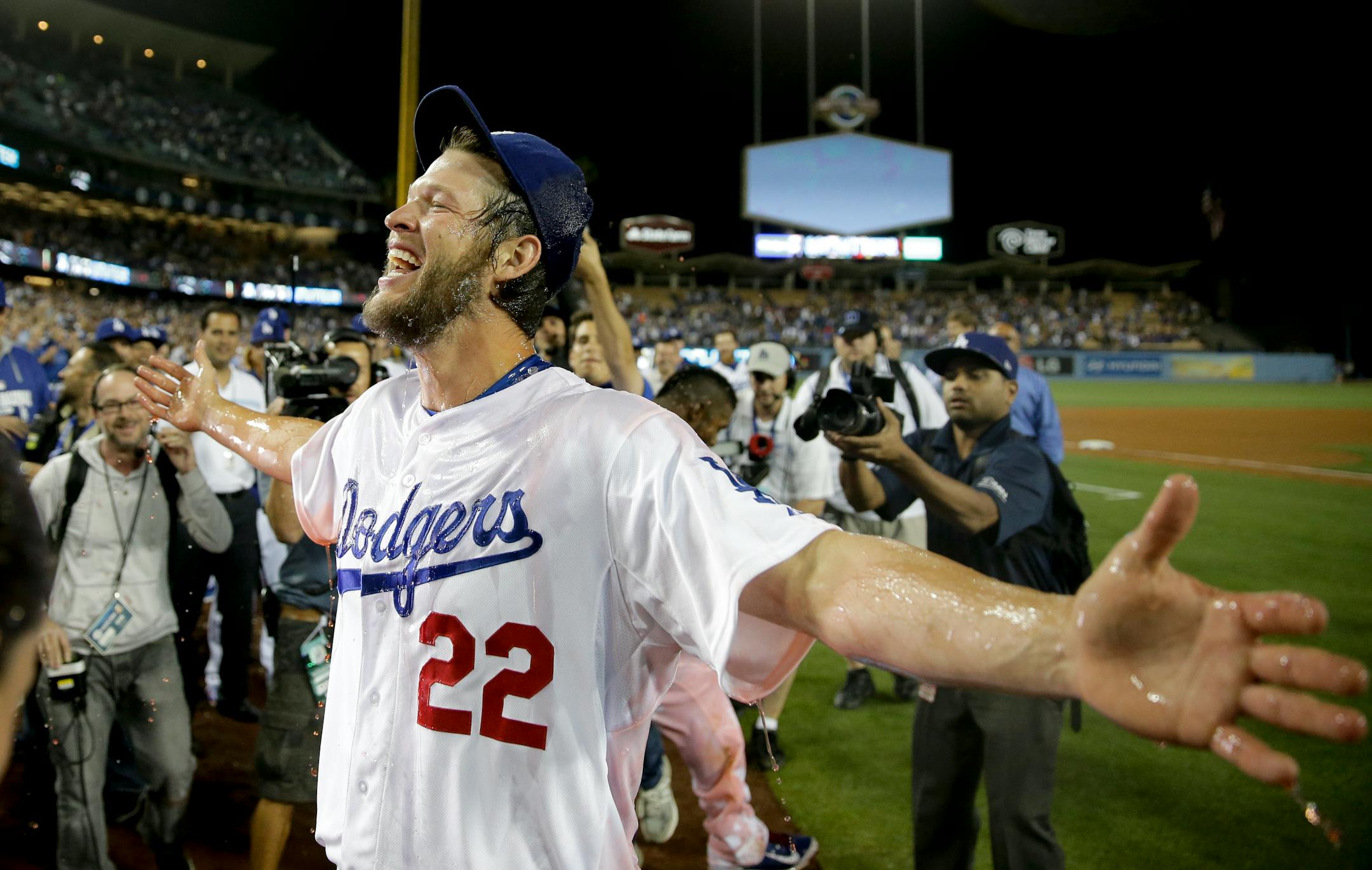 Los Angeles Dodgers starting pitcher Clayton Kershaw celebrates his no-hitter against the Colorado Rockies after a baseball game in Los Angeles, Wednesday, June 18, 2014. Kershaw struck out a career-high 15 batters. (AP Photo/Chris Carlson)
