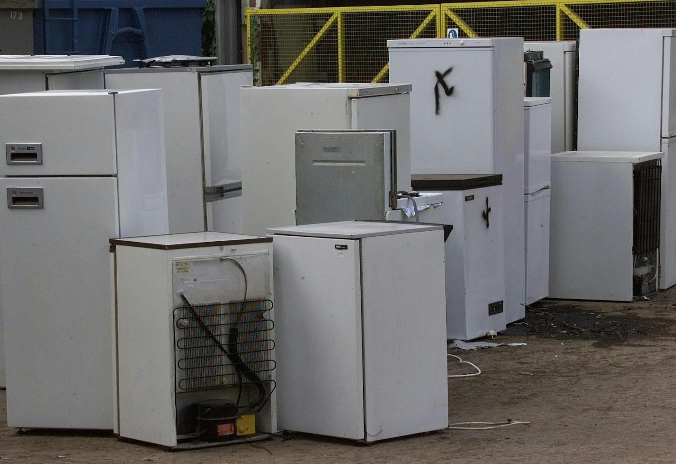 Some of the fridges left in a dump near Bracknell, on the outskirts of London Thursday, June 20, 2002. The stockpile of discarded refrigerators has been spawned by tough European Union environment rules making it illegal to discard them as they contain chlorofluorocarbons, known as CFCs, which are thought to damage the world's ozone layer. Clearing the still growing stockpile of fridges will cost Britain some 40 million pounds (dlrs 60 Mil US) to clear, according to lawmakers Thursday. (AP Photo