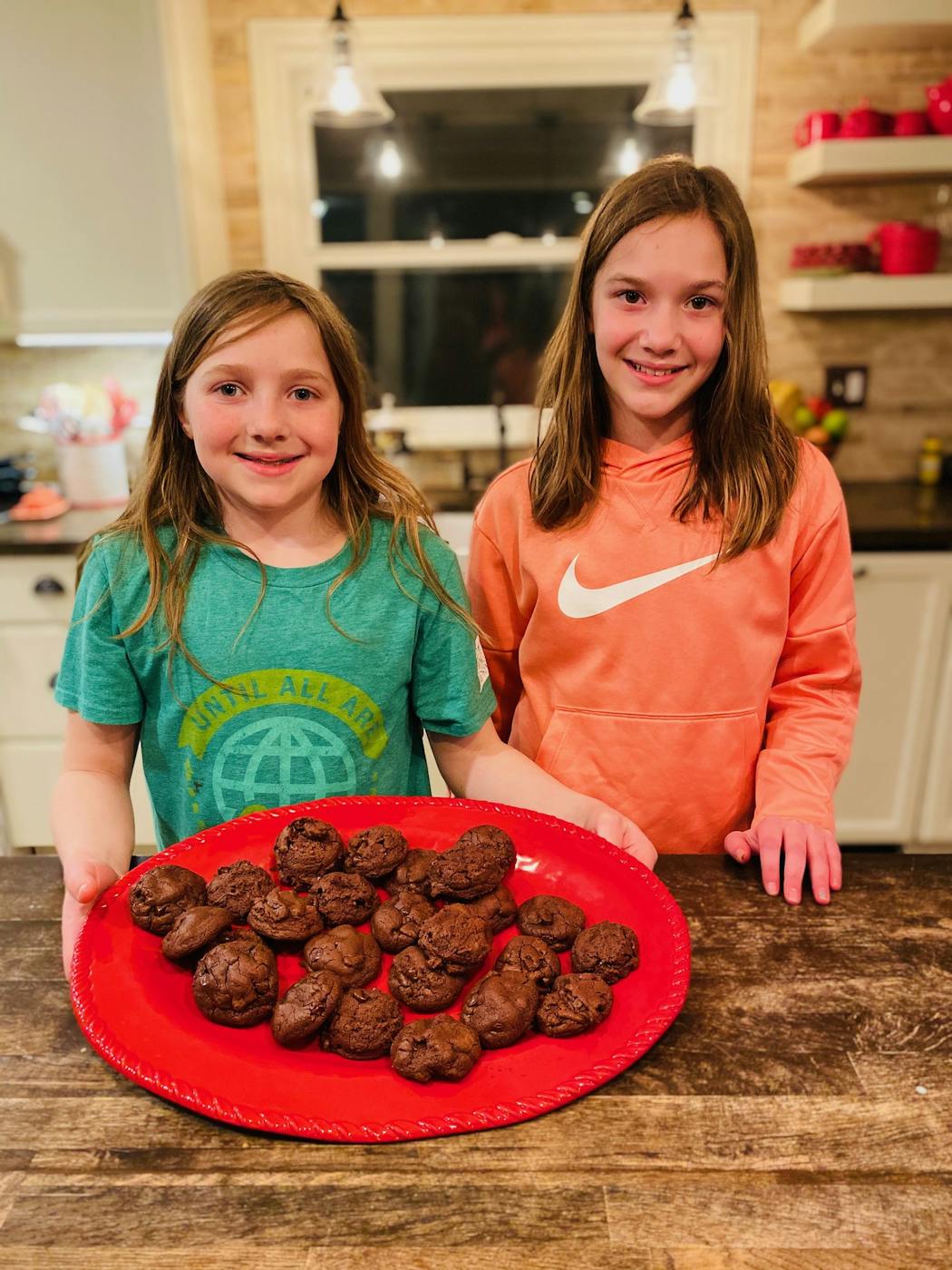 MaryKate, 10, and Kristiana, 11, from Arden Hills, show off their chocolate brownie cookies.
