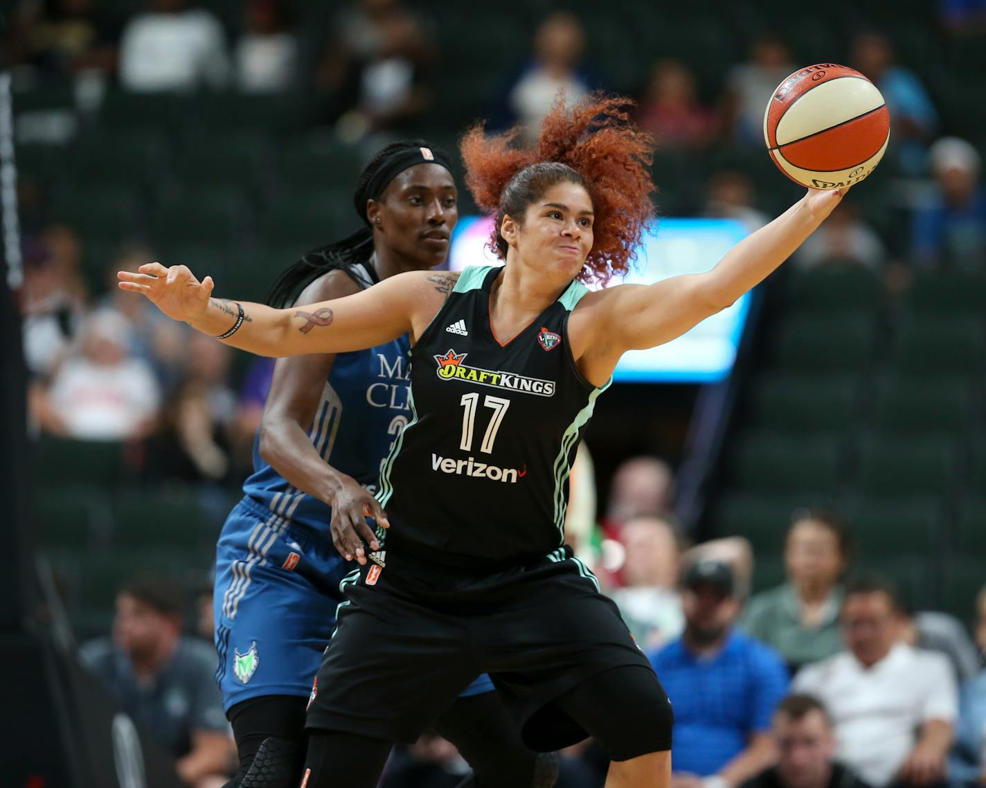 New York Liberty center Amanda Zahui B., a former Gophers player, reached for a pass while defended by Lynx center Sylvia Fowles during a game in 2017.