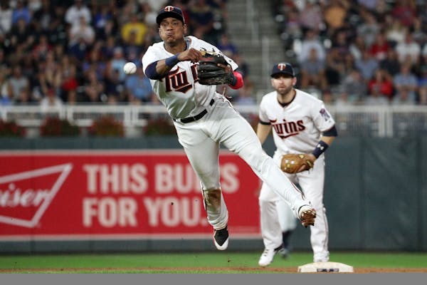 Twins shortstop Jorge Polanco threw to first after fielding a ball hit by the Brewers' Ryan Braun in the fourth inning Tuesday night.