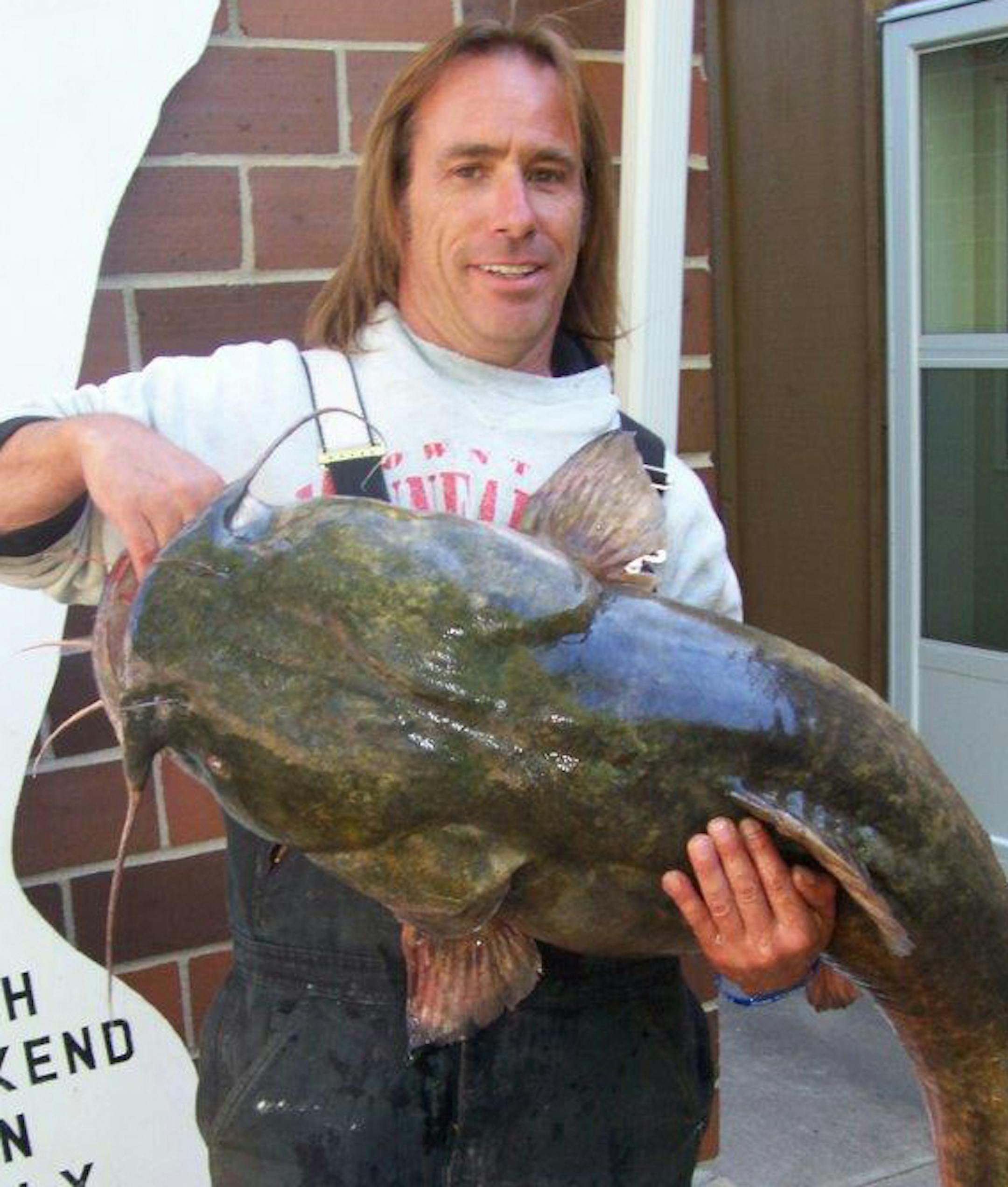Steve Fisher of South Haven, Minn., with a monster 52-pound, 5-ounce flathead catfish he caught last year at Franklin's Catfish Derby Days.