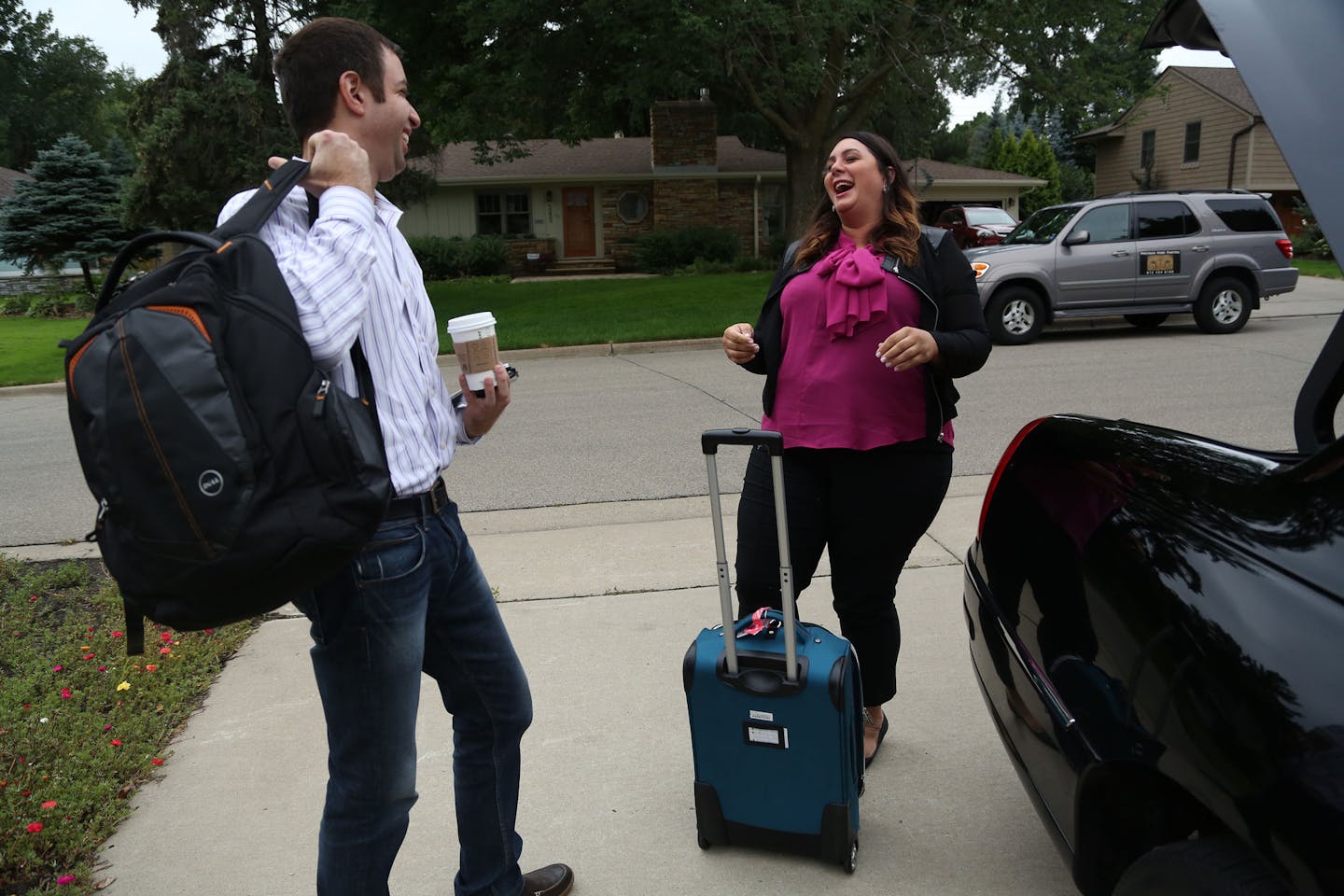 Chey Eisenman, of Chey Cab, laughed with a regular client after dropping him off. ] (KYNDELL HARKNESS/STAR TRIBUNE) kyndell.harkness@startribune.com Chey Eisenman owner of Chey Cab drove clients to their destinations in St. Paul, Min., Tuesday, September 9, 2014.