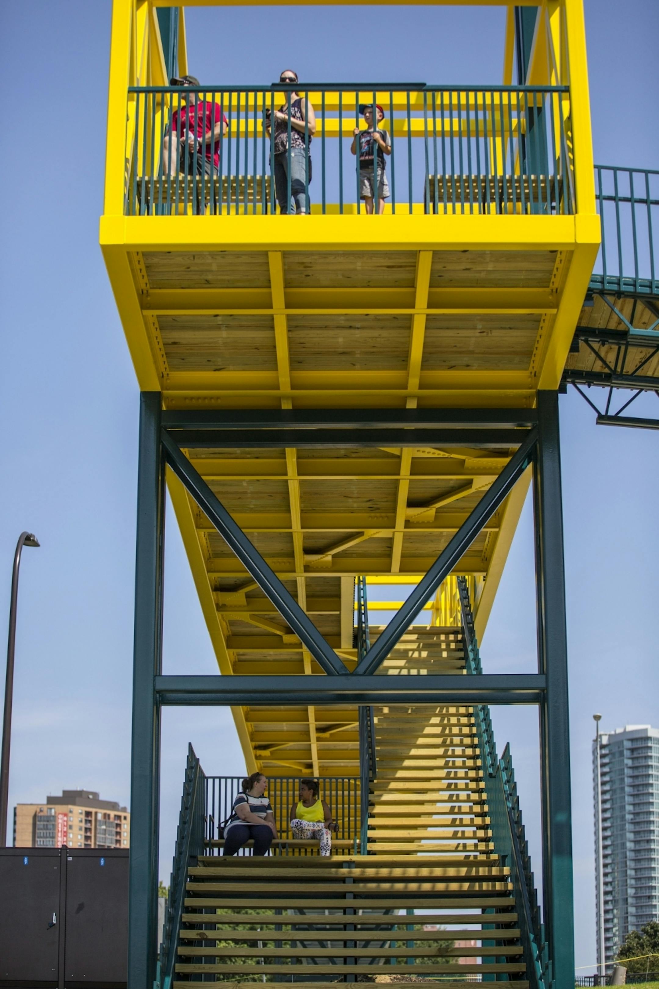 People enjoy the bridge at every level of the structure.