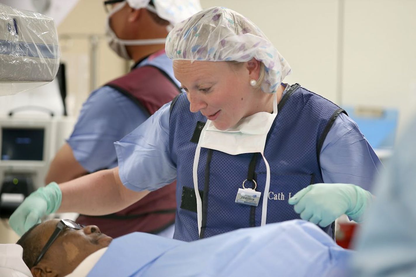 Gina Jacobsen, RN, checked on patient Joe Jones after Fouad Bachour, MD, and his team implanted a CardioMem, a new St. Jude product, into him at Hennepin County Medical Center, Thursday, February 26, 2015 in Minneapolis, MN.