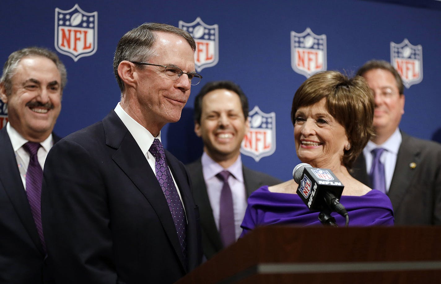 Minneapolis bid committee co-chairs Richard Davis, left, CEO of U.S. Bancorp, and Marilyn Carlson Nelson, right, speak at a news conference after Minneapolis was selected as the host for 2018 Super Bowl at the NFL's spring meetings, Tuesday, May 20, 2014, in Atlanta. Minneapolis will host the 2018 Super Bowl after a vote by owners on Tuesday rewarded the city for getting a new stadium deal. The owners chose Minneapolis and the new $1 billion stadium planned for the site of the old Metrodome to h